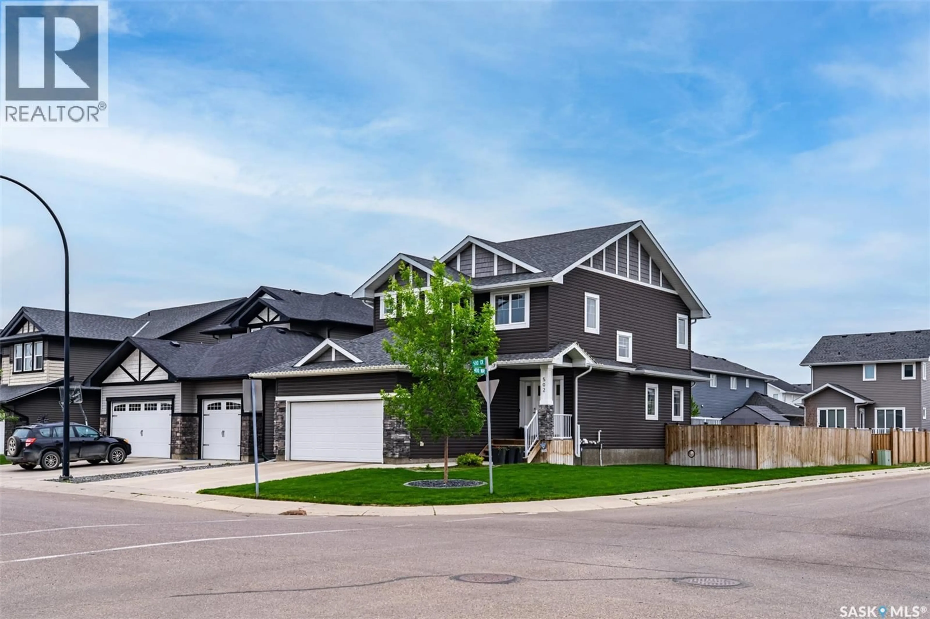Home with vinyl exterior material, street for 502 CHILDERS CRESCENT, Saskatoon Saskatchewan S7L4P2