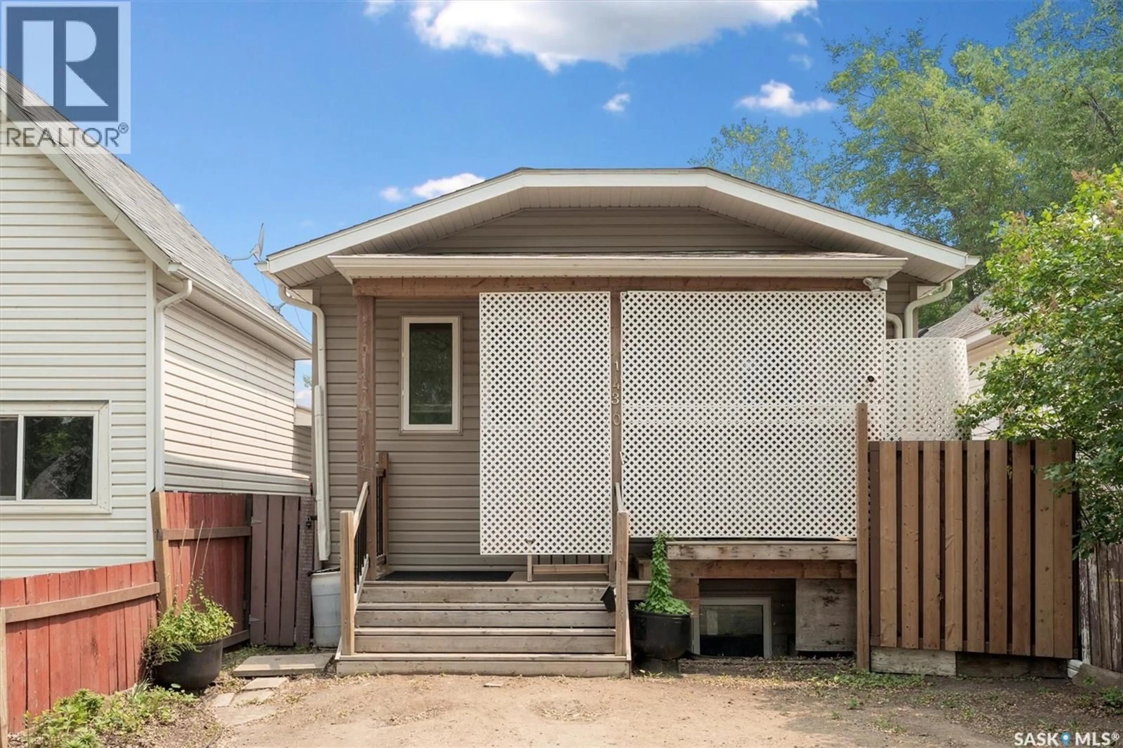 Home with vinyl exterior material, street for 1430 C AVENUE, Saskatoon Saskatchewan S7L1L1