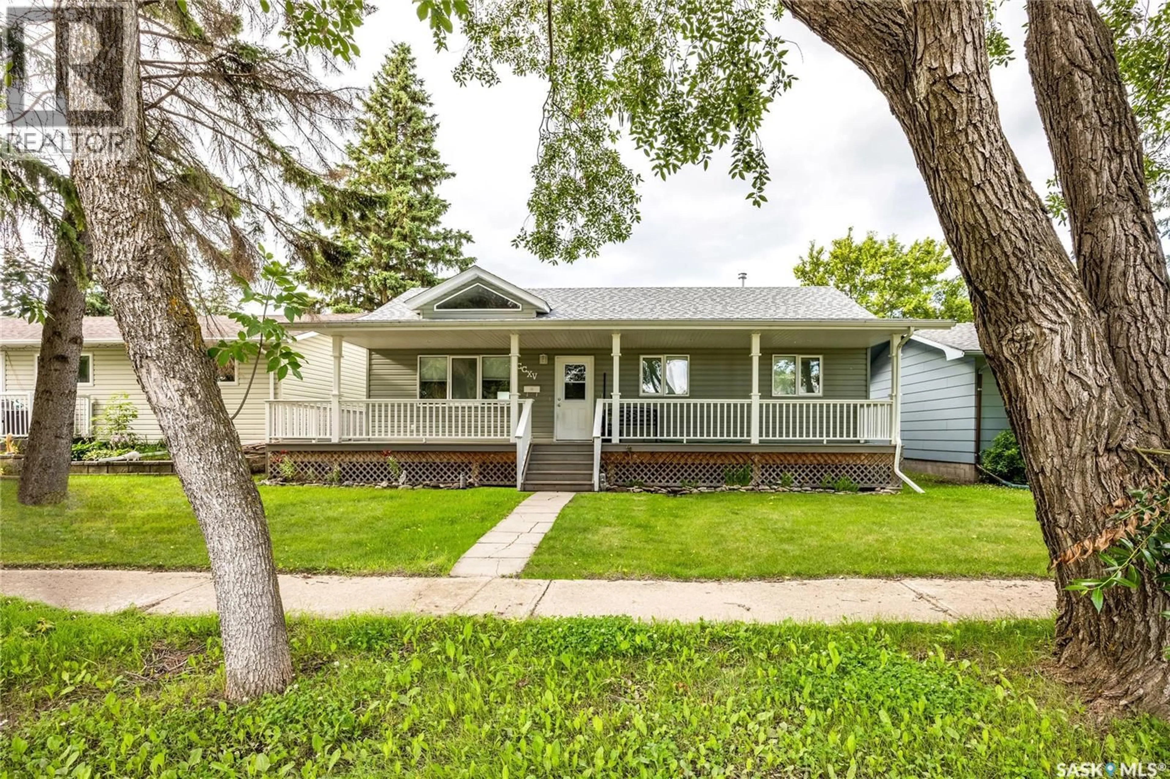 Home with vinyl exterior material, street for 215 2ND STREET, Langham Saskatchewan S0K2L0
