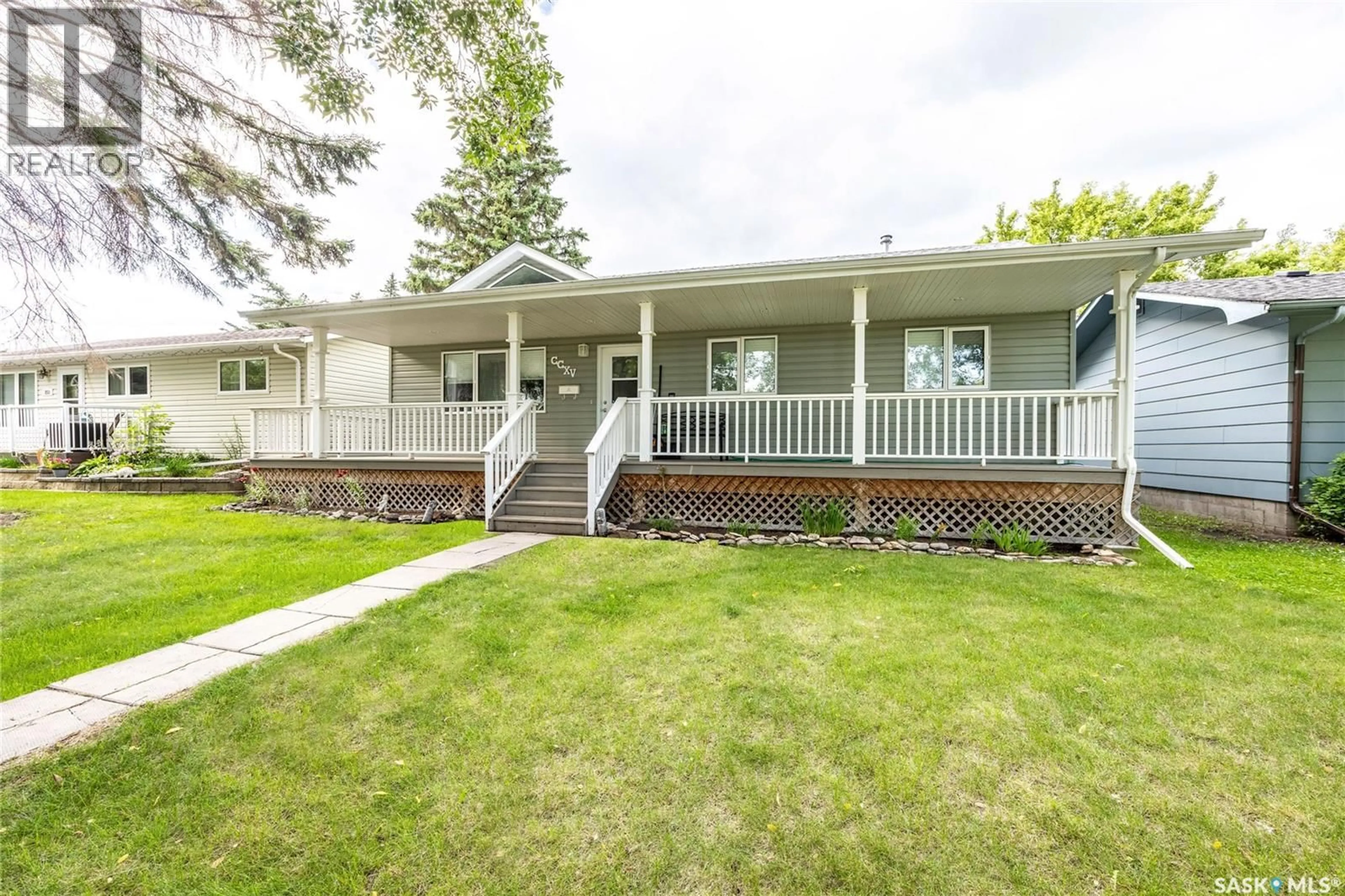 Home with vinyl exterior material, street for 215 2ND STREET, Langham Saskatchewan S0K2L0