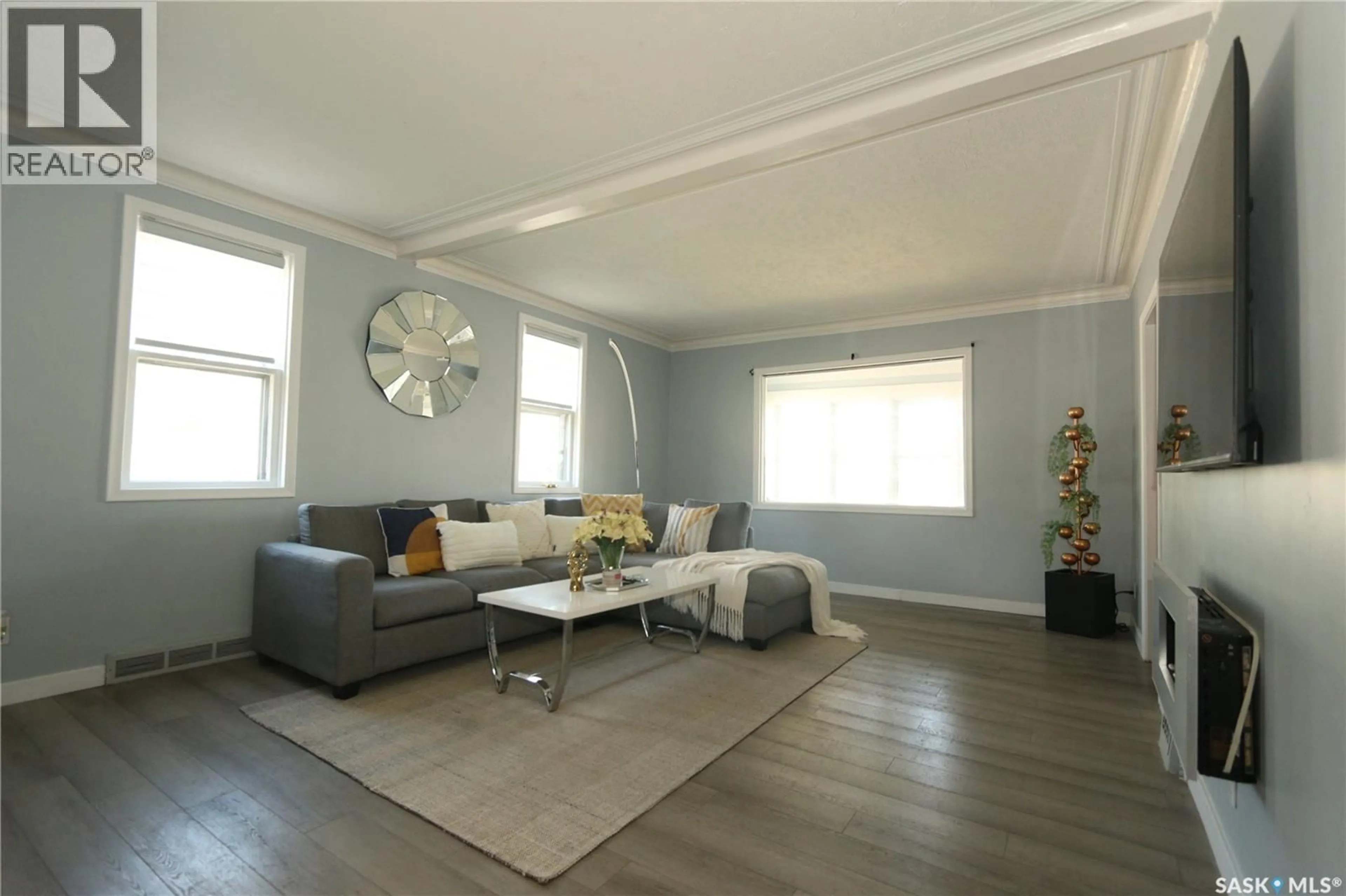 Living room with furniture, wood/laminate floor for 2100 ATKINSON STREET, Regina Saskatchewan S4N3W9