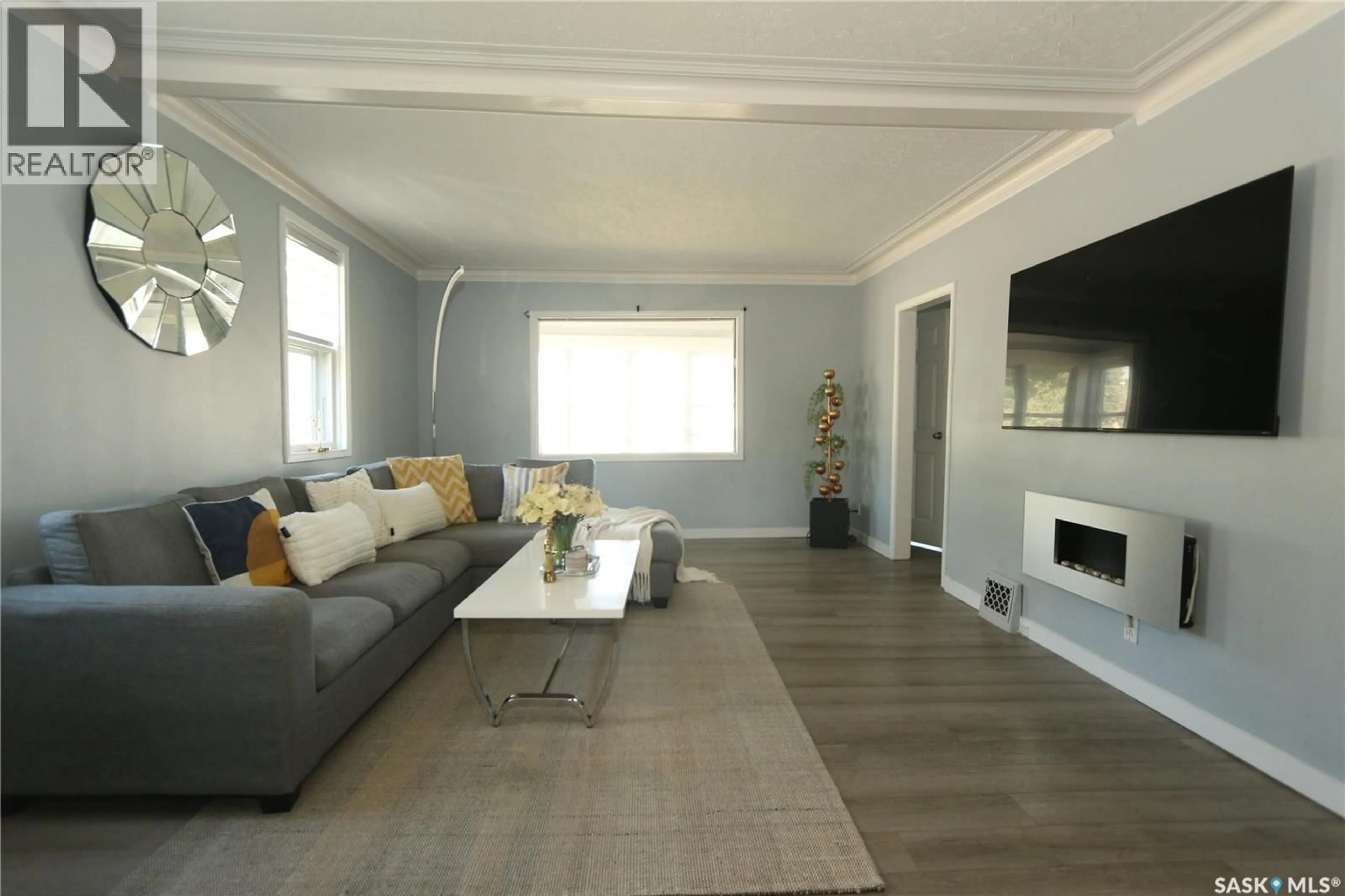Living room with furniture, wood/laminate floor for 2100 ATKINSON STREET, Regina Saskatchewan S4N3W9