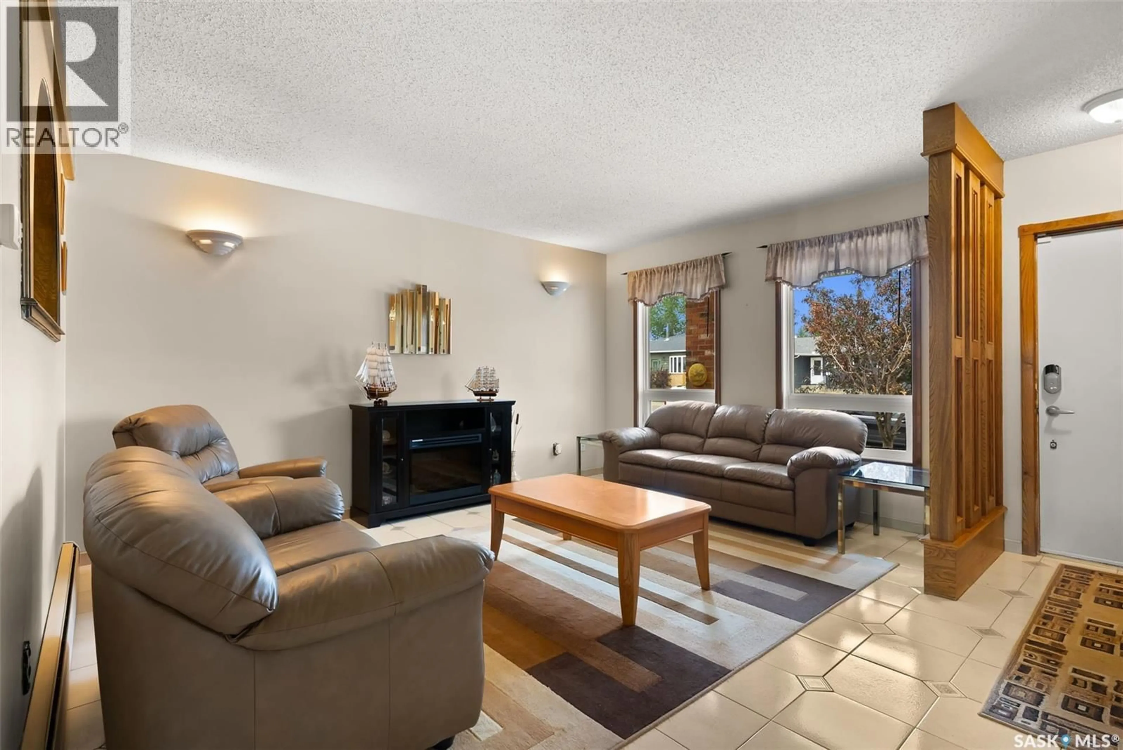 Living room with furniture, unknown for 10 TATE STREET, Regina Saskatchewan S4X1X4