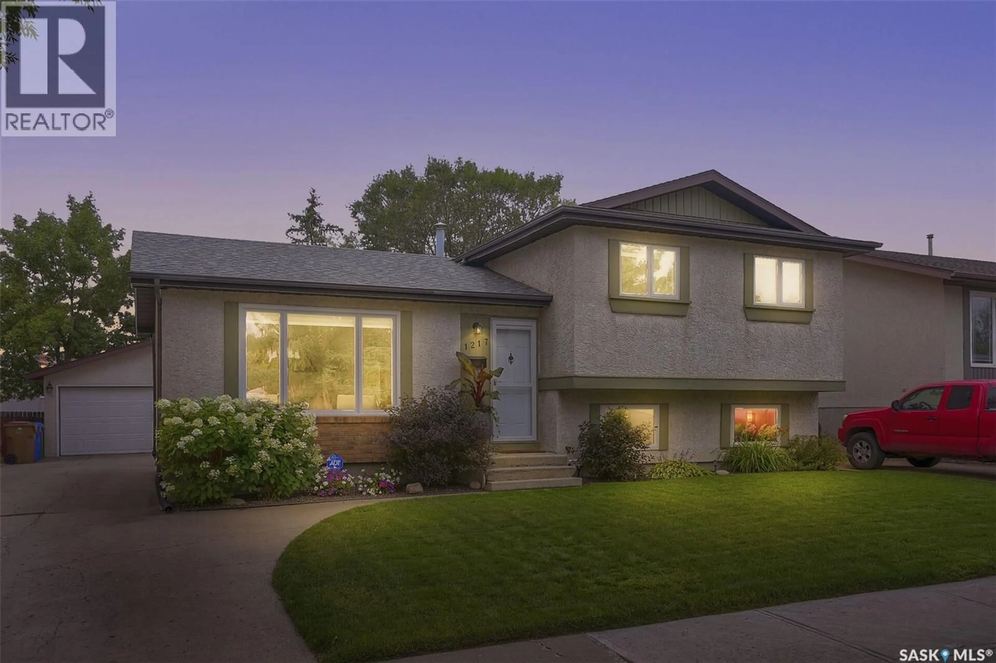 Home with vinyl exterior material, street for 1217 RUNCIMAN CRESCENT, Regina Saskatchewan S4X2Z3