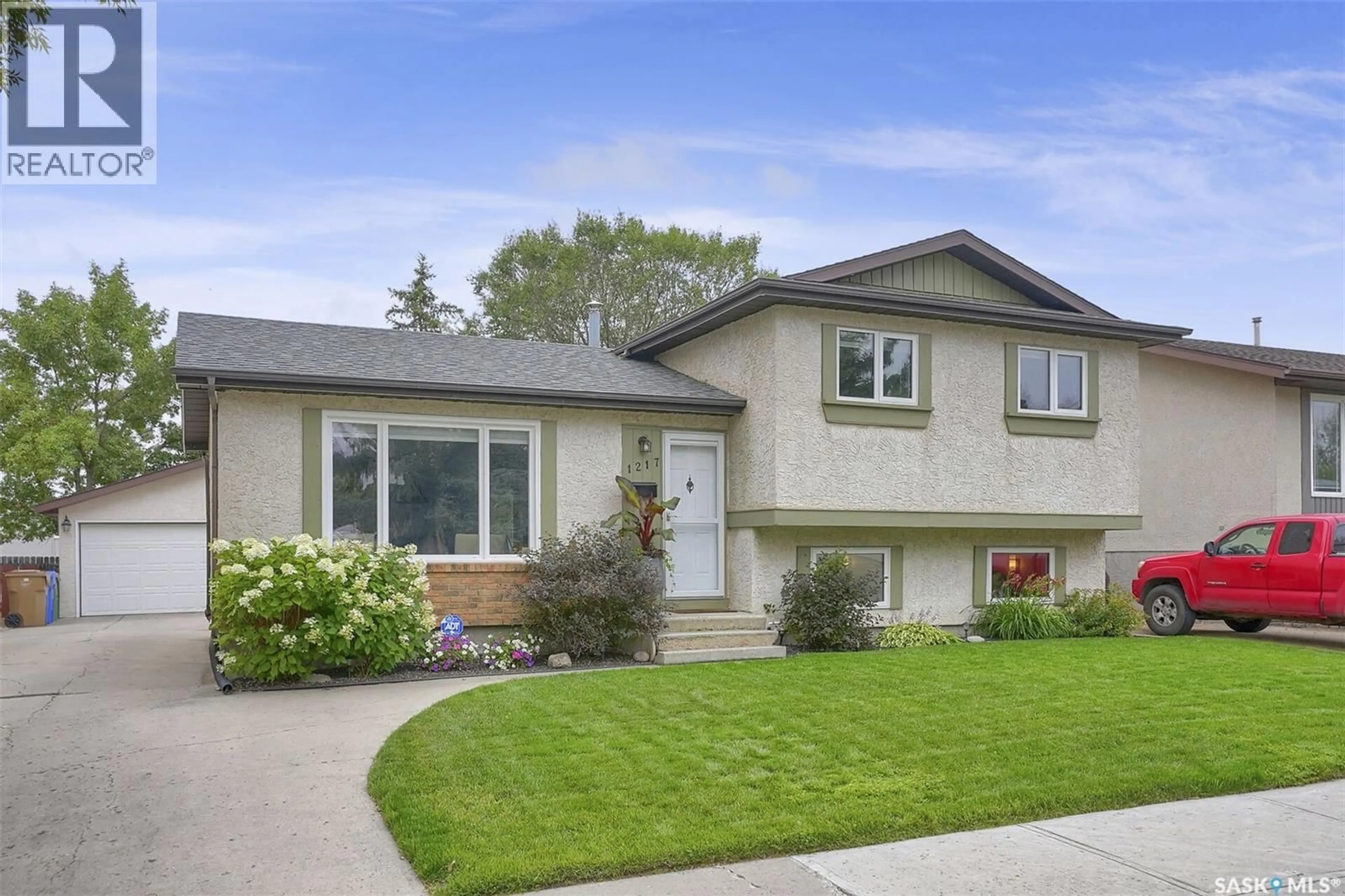 Home with vinyl exterior material, street for 1217 RUNCIMAN CRESCENT, Regina Saskatchewan S4X2Z3