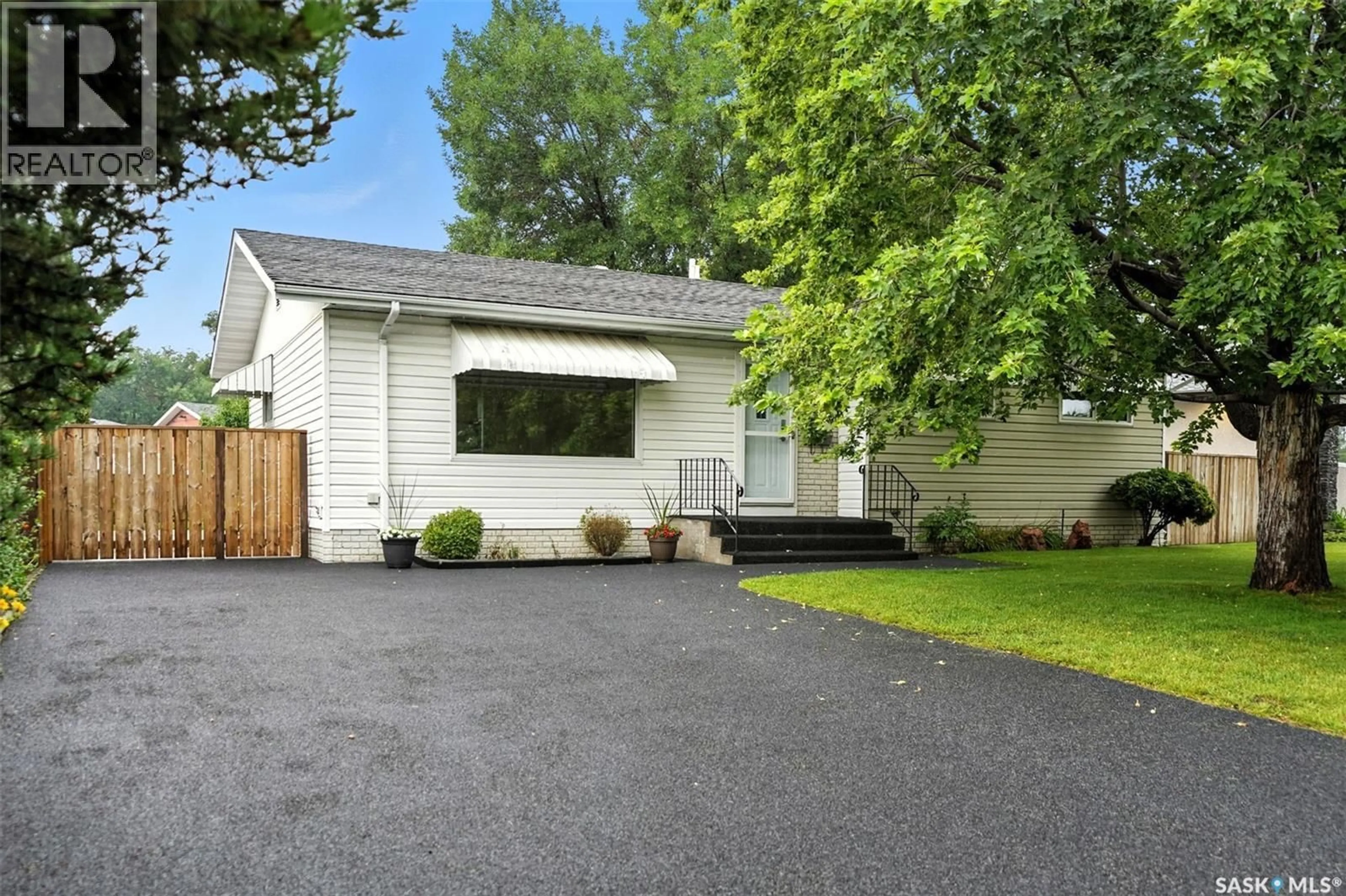 Home with vinyl exterior material, street for 2210 EASTHILL, Saskatoon Saskatchewan S7J3E2