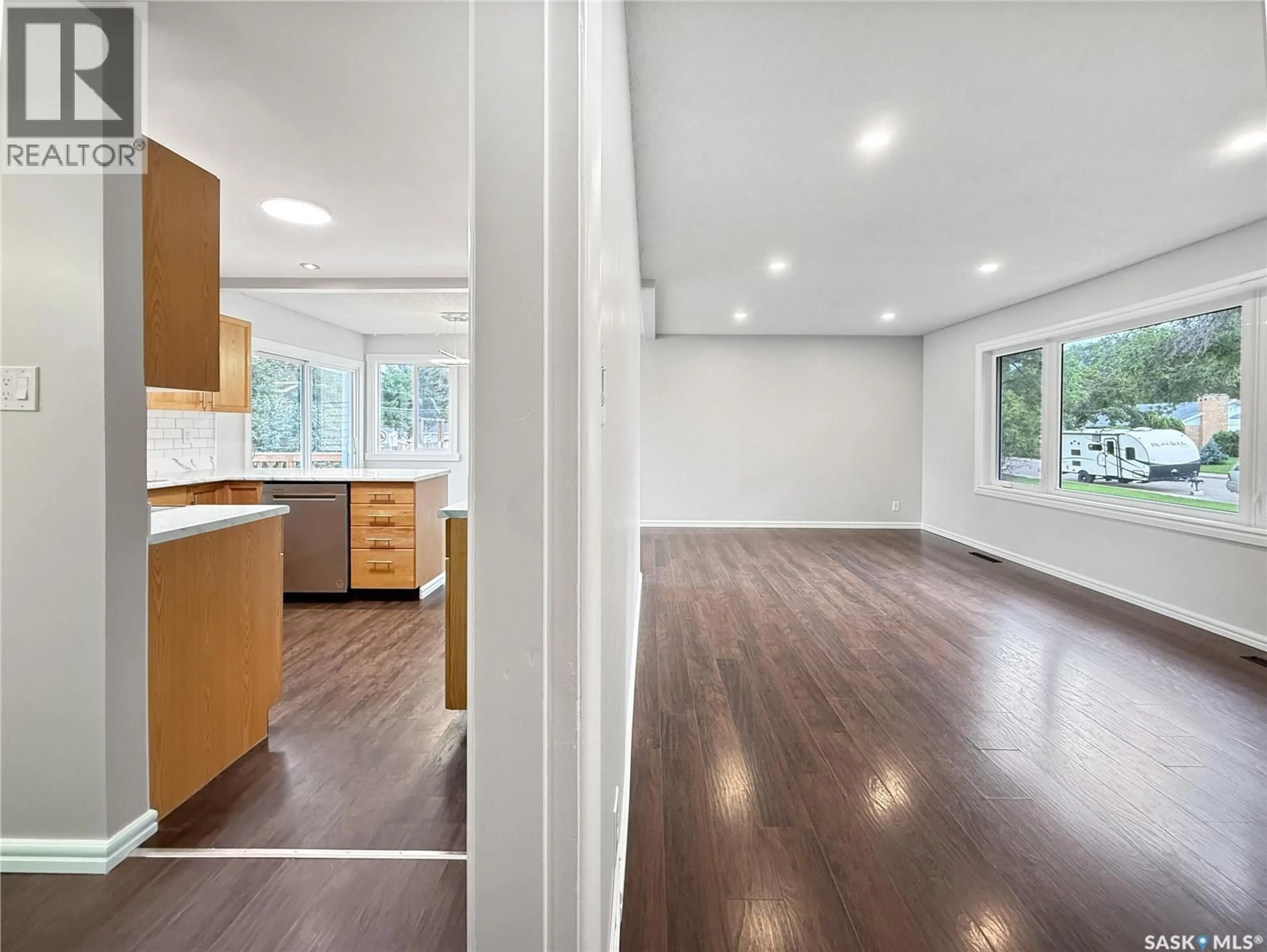 Open concept kitchen, wood/laminate floor for 881 8TH AVENUE, Swift Current Saskatchewan S9H2R6