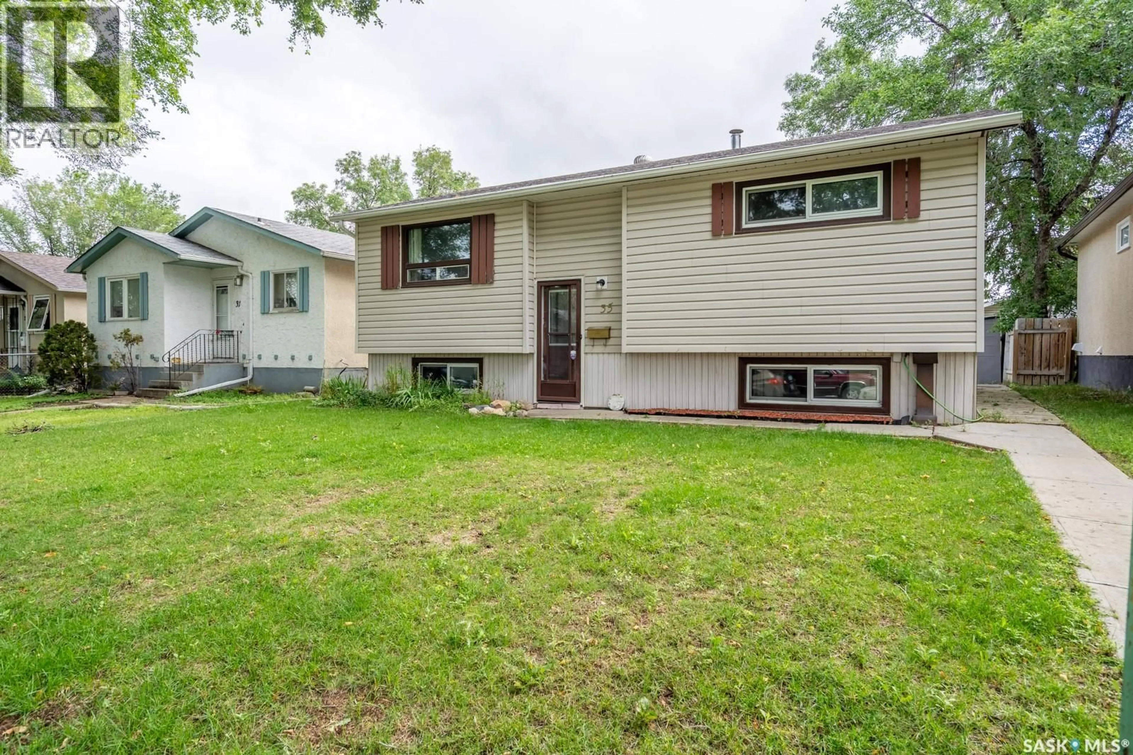 Home with vinyl exterior material, street for 35 MARSHALL CRESCENT, Regina Saskatchewan S4R4Y8