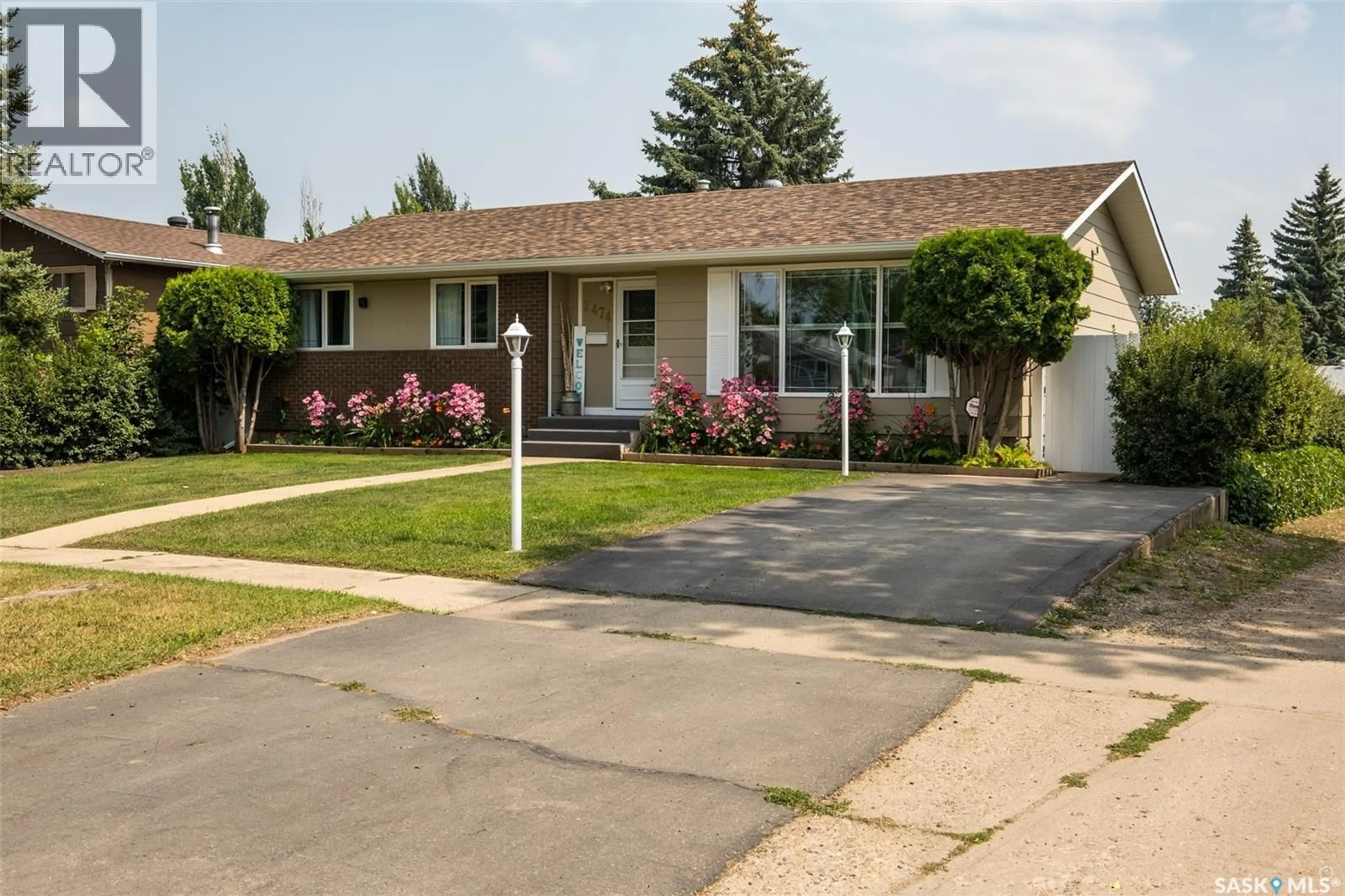 Home with vinyl exterior material, street for 2474 15TH AVENUE, Prince Albert Saskatchewan S6V6J1