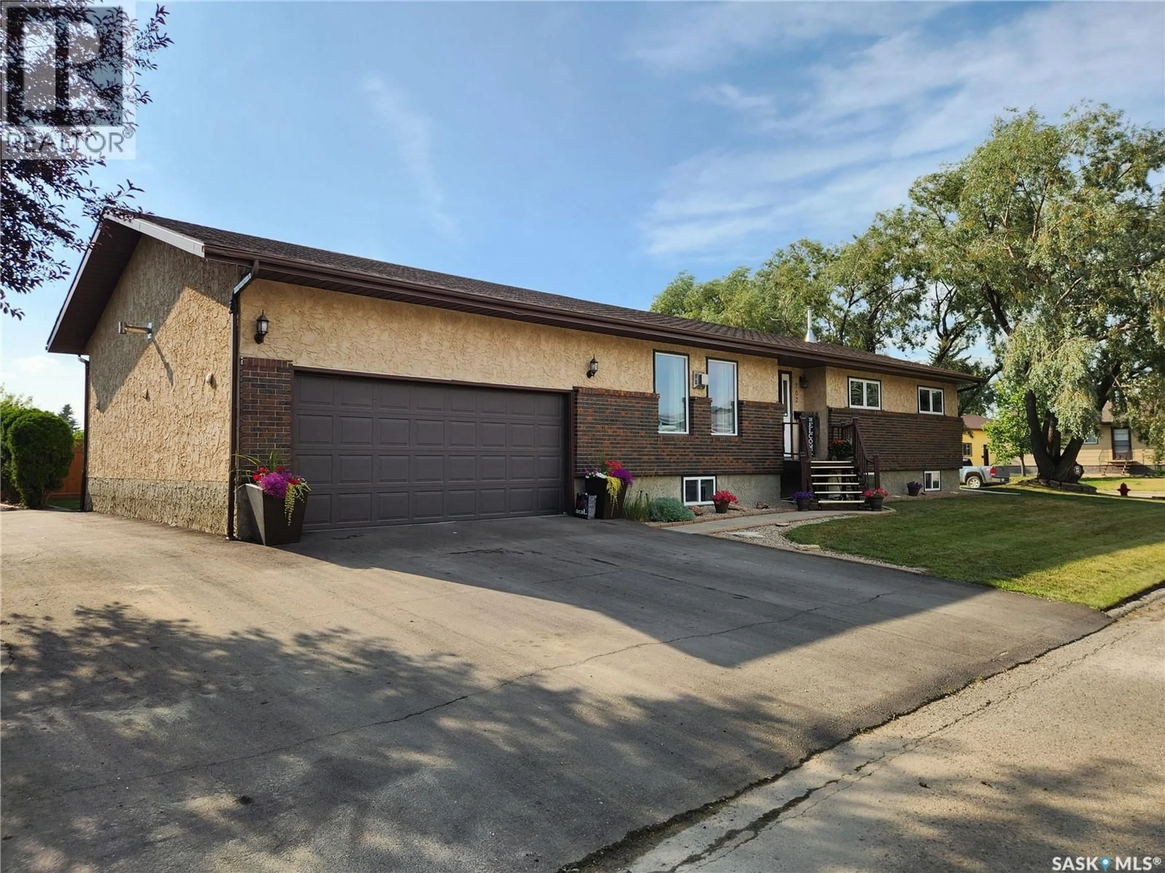 Home with brick exterior material, street for 702 GOLBURN CRESCENT, Tisdale Saskatchewan S0E1T0