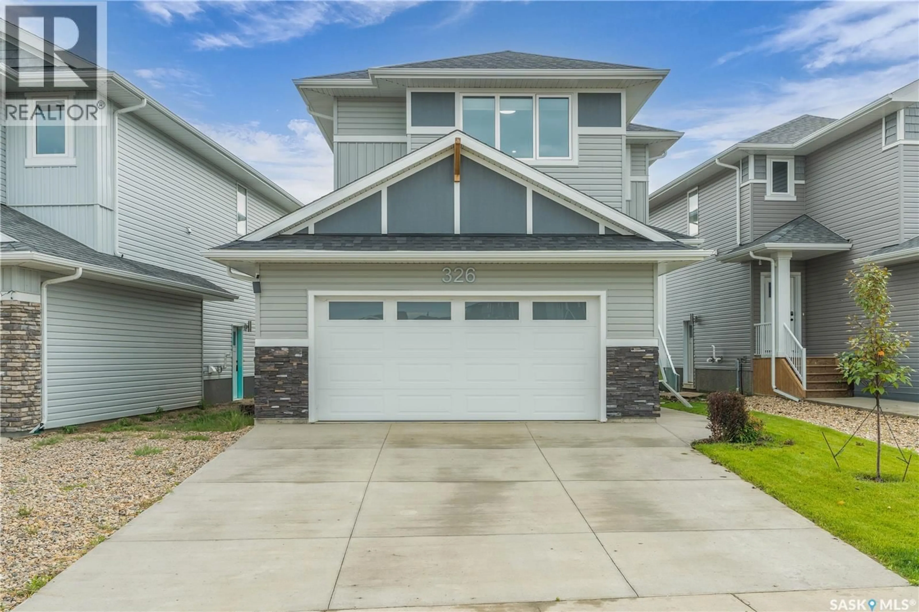 Home with vinyl exterior material, street for 326 PRASAD UNION, Saskatoon Saskatchewan S7V1L7