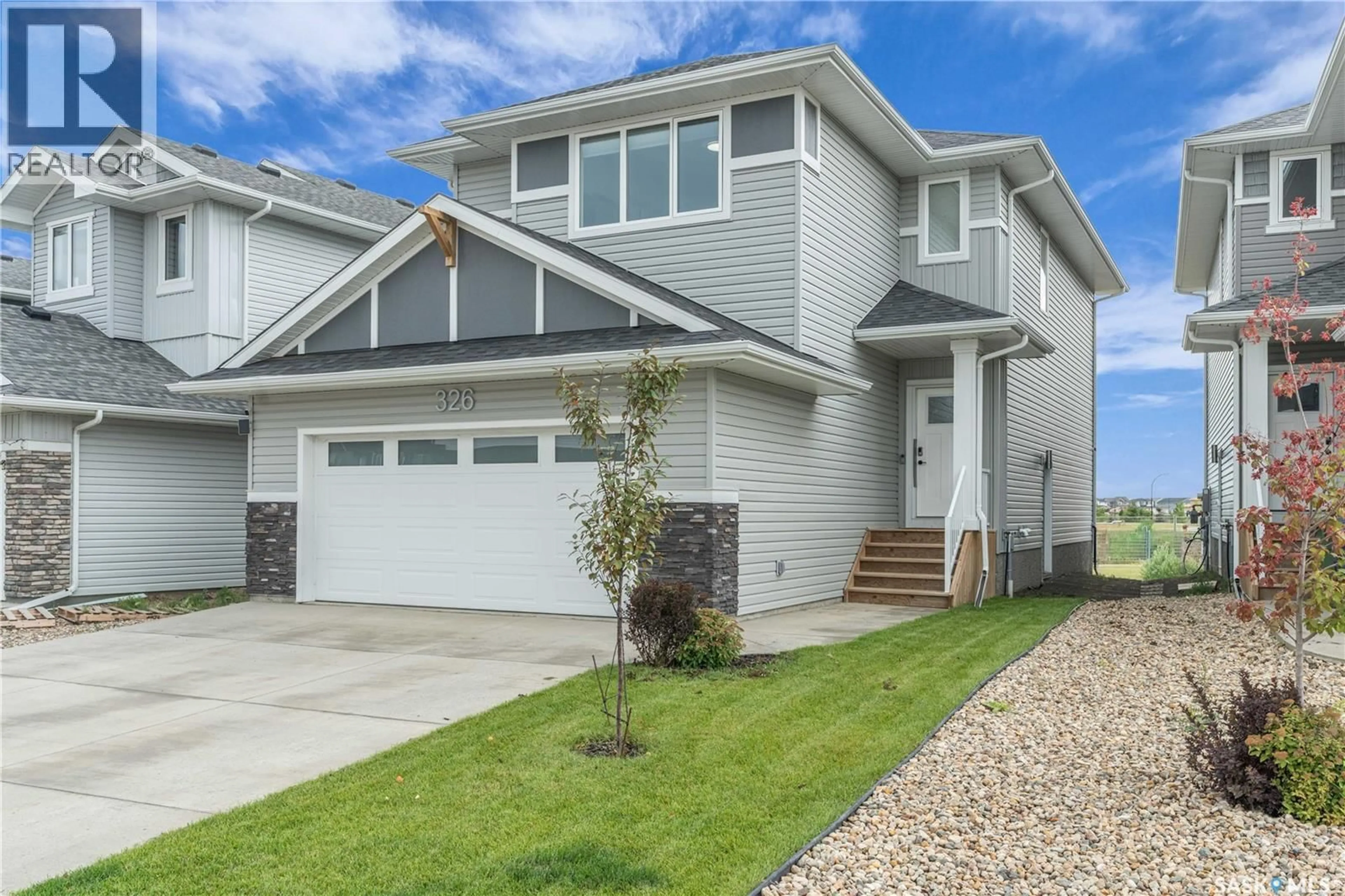 Home with vinyl exterior material, street for 326 PRASAD UNION, Saskatoon Saskatchewan S7V1L7