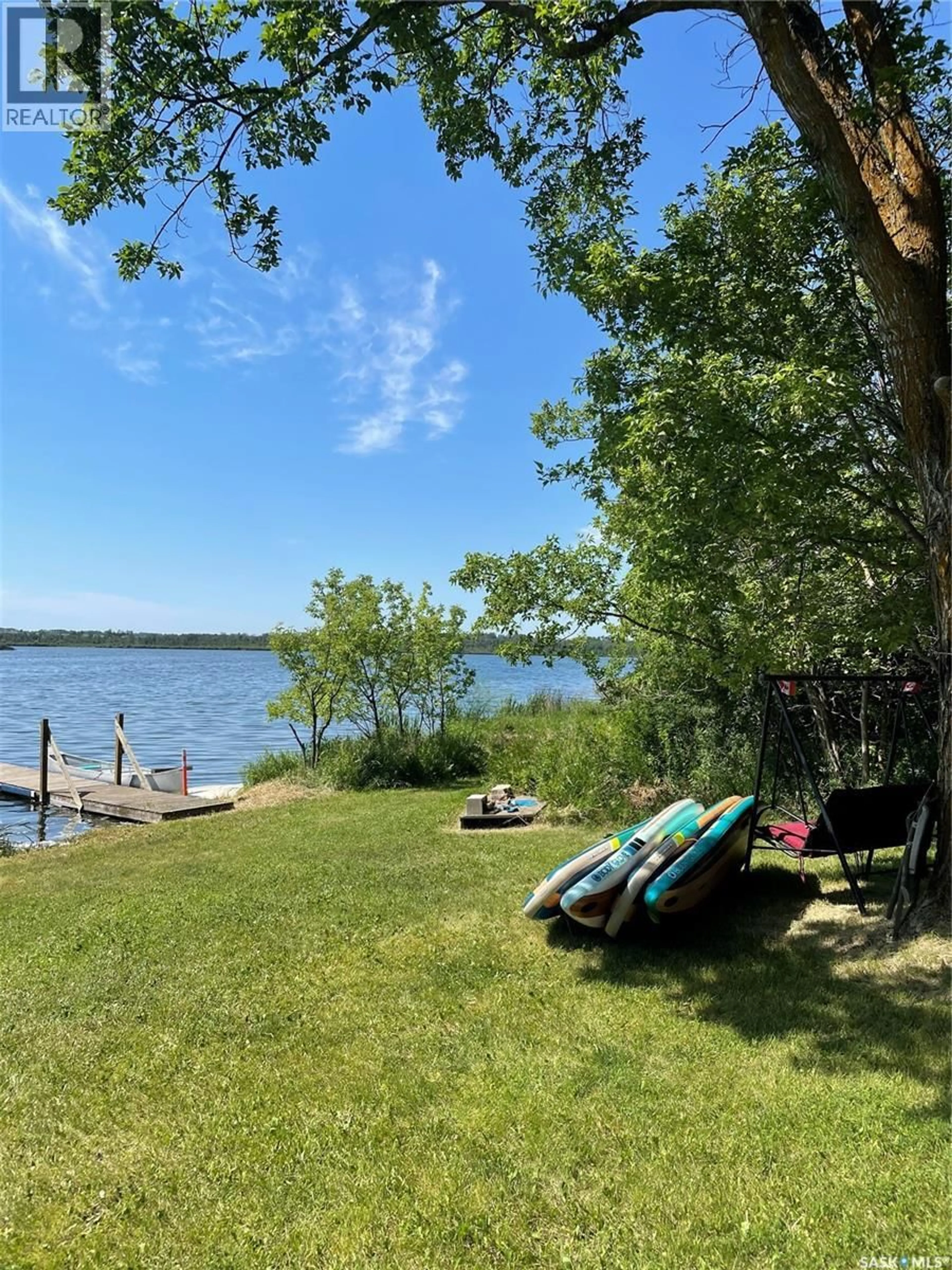 A pic from outside/outdoor area/front of a property/back of a property/a pic from drone, water/lake/river/ocean view for 120 WAKAW LAKE ACRES, Hoodoo Rm No. 401 Saskatchewan S0K4P0