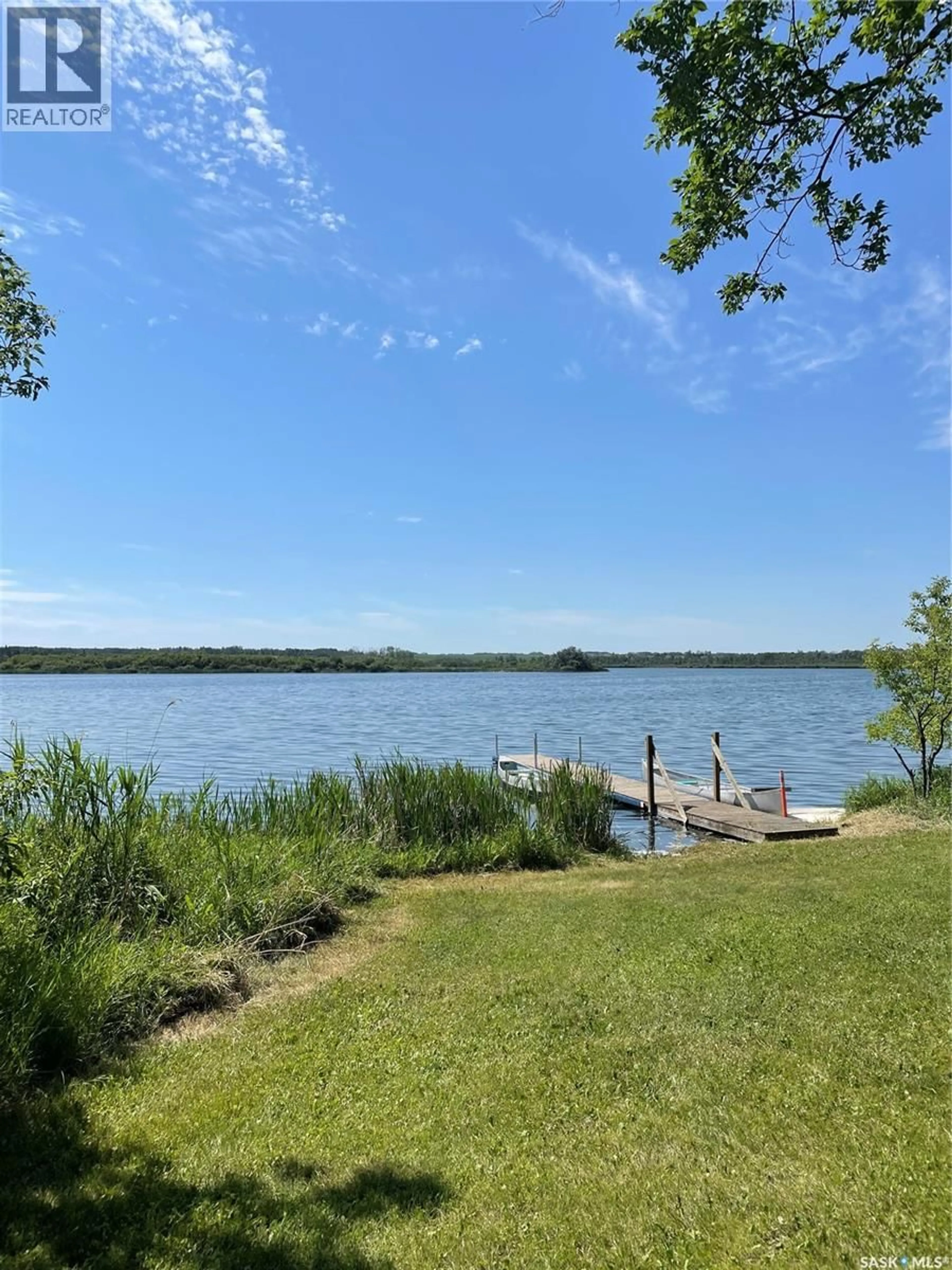 A pic from outside/outdoor area/front of a property/back of a property/a pic from drone, water/lake/river/ocean view for 120 WAKAW LAKE ACRES, Hoodoo Rm No. 401 Saskatchewan S0K4P0