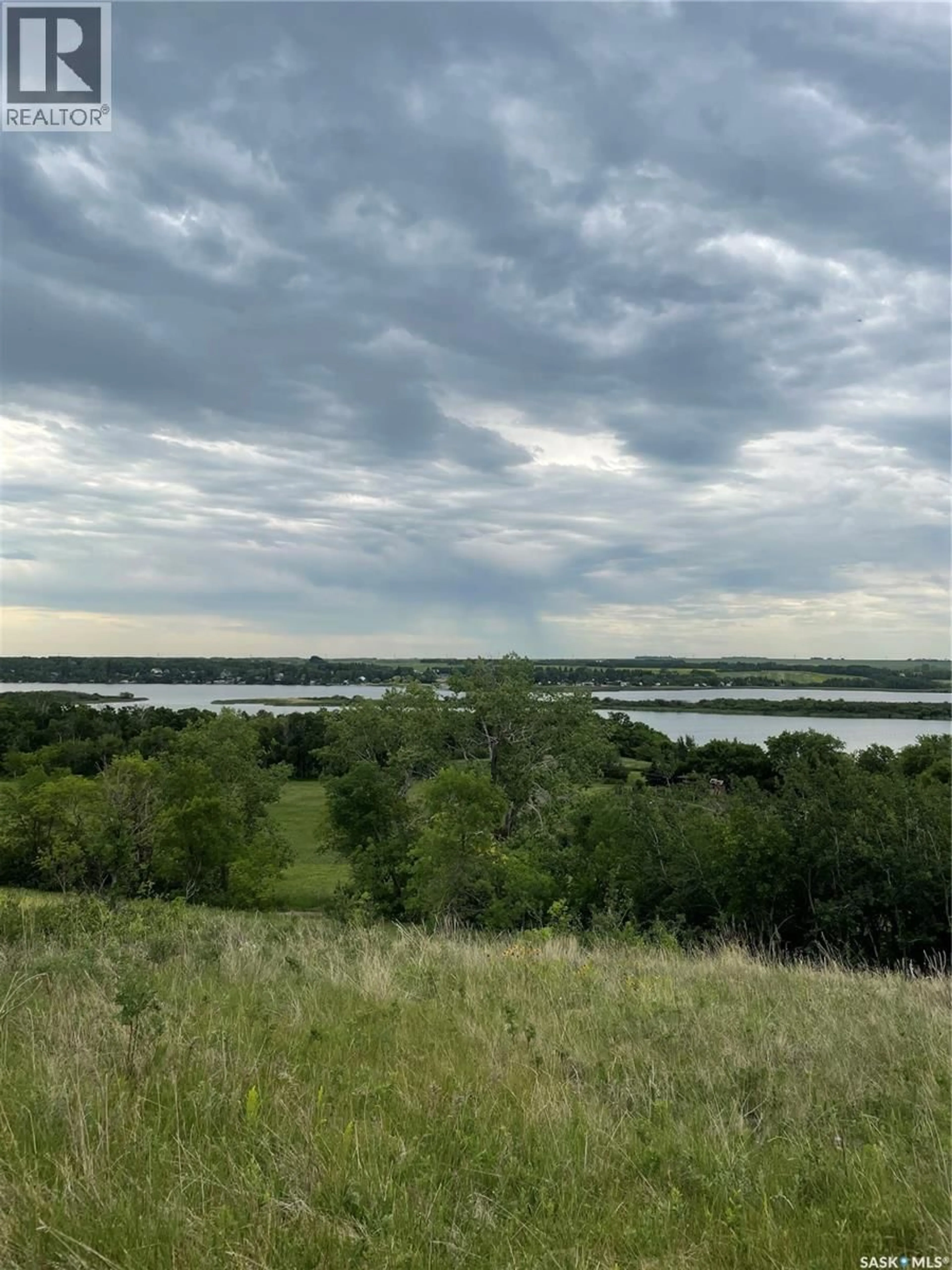 A pic from outside/outdoor area/front of a property/back of a property/a pic from drone, water/lake/river/ocean view for 120 WAKAW LAKE ACRES, Hoodoo Rm No. 401 Saskatchewan S0K4P0