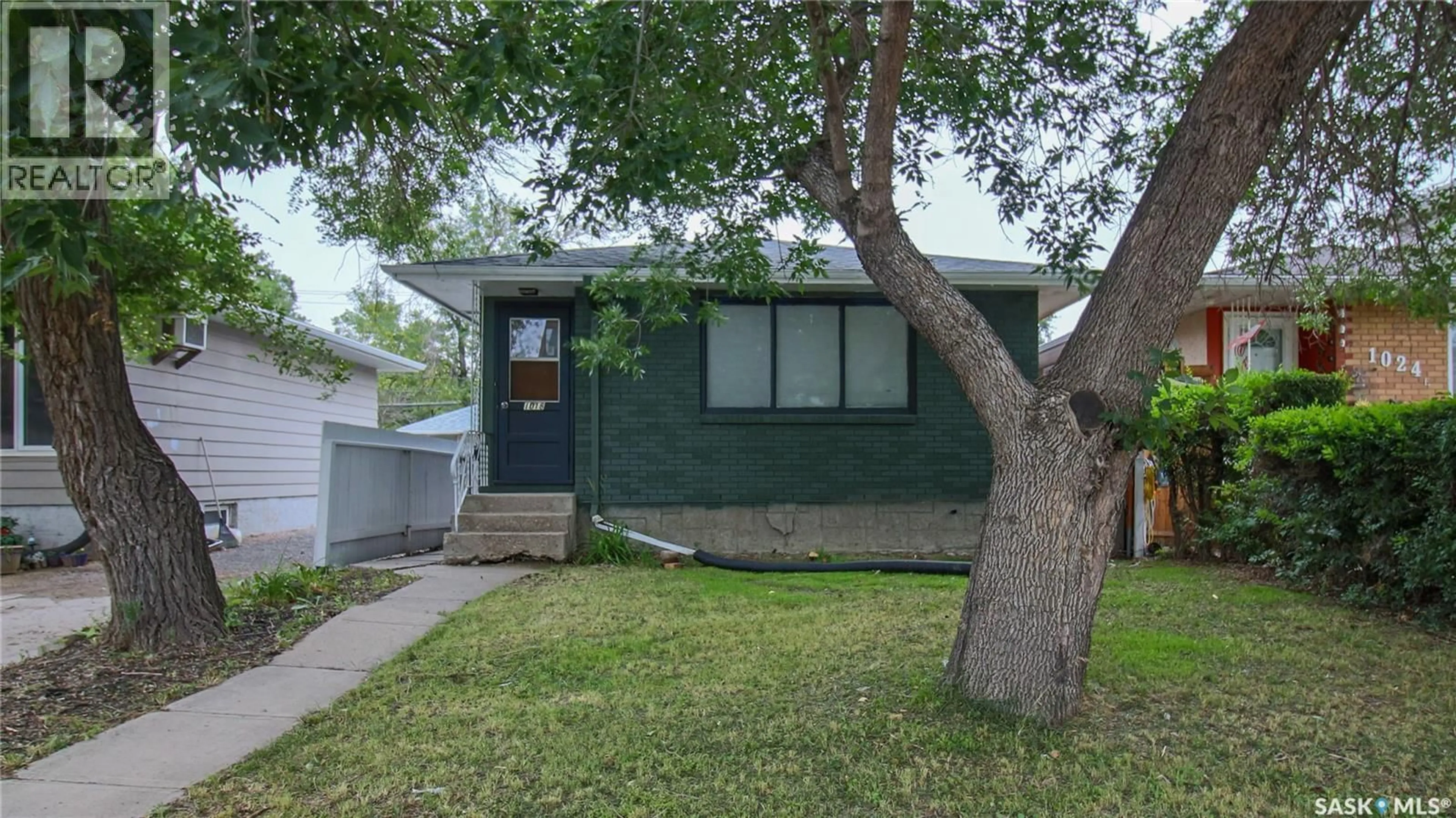 Home with vinyl exterior material, street for 1018 DEWDNEY AVENUE, Regina Saskatchewan S4N0C8