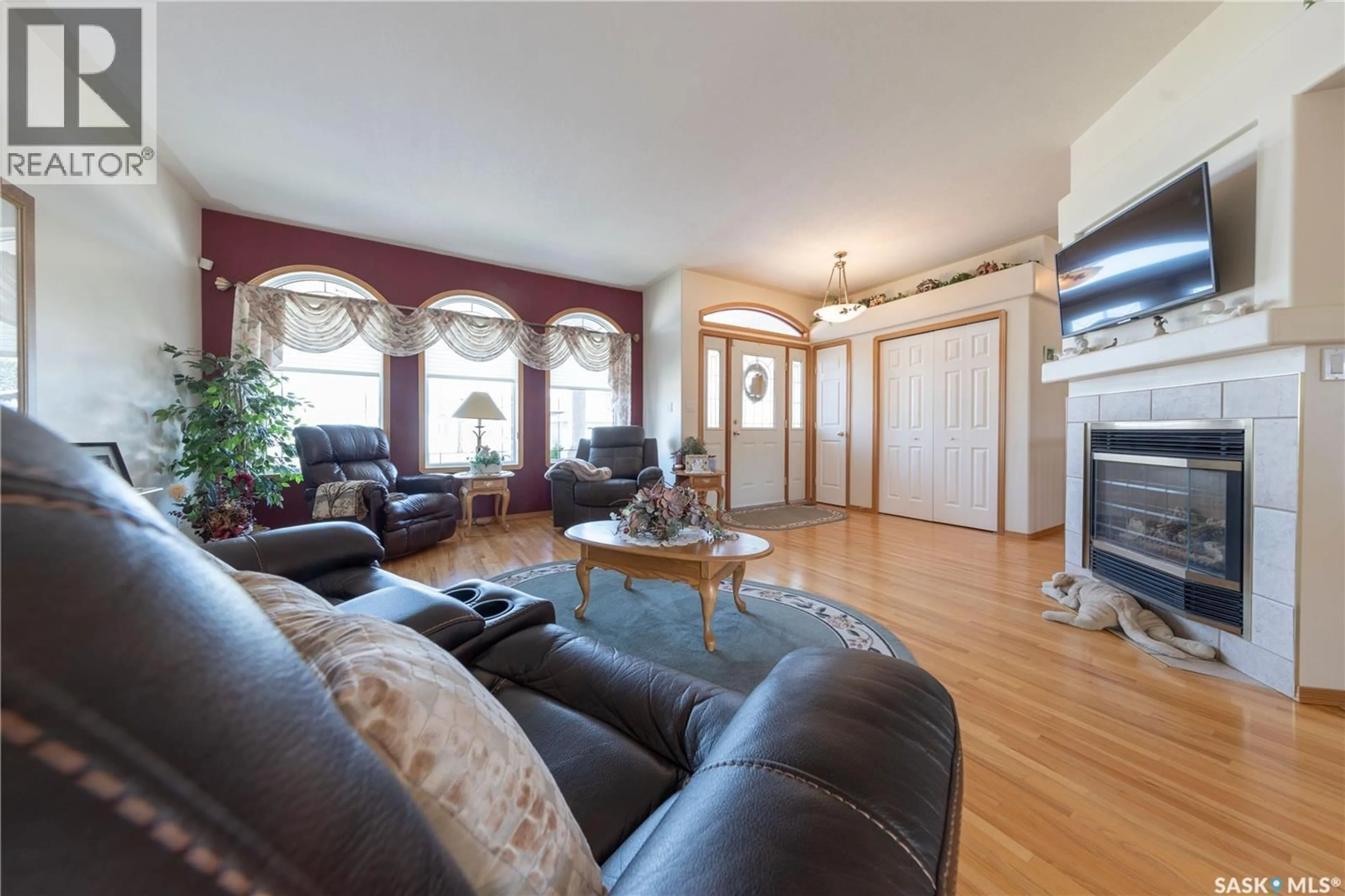Living room with furniture, wood/laminate floor for 5329 HERALD STREET, Macklin Saskatchewan S0L2C0