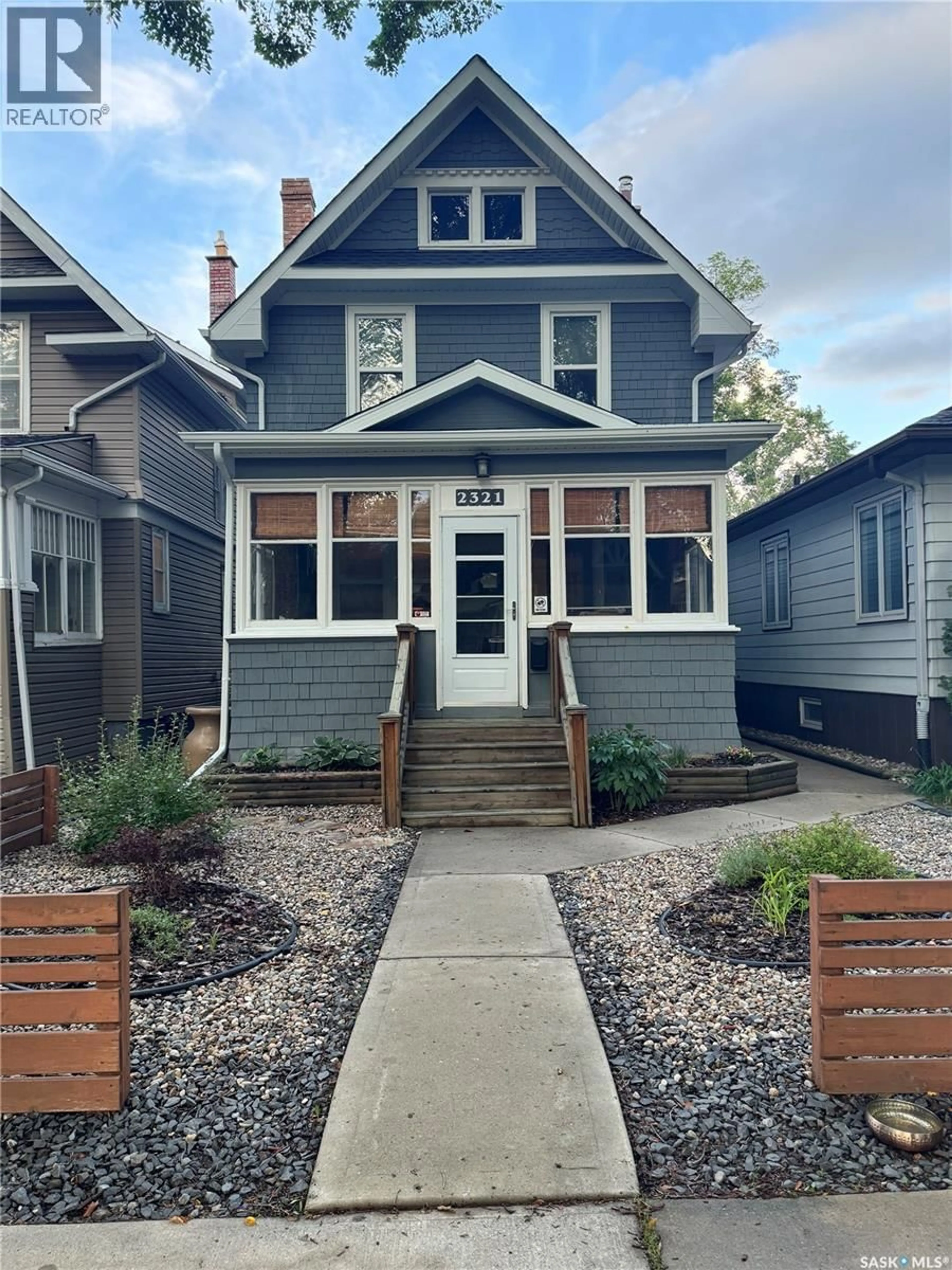 Home with vinyl exterior material, street for 2321 GARNET STREET, Regina Saskatchewan S4T3A3