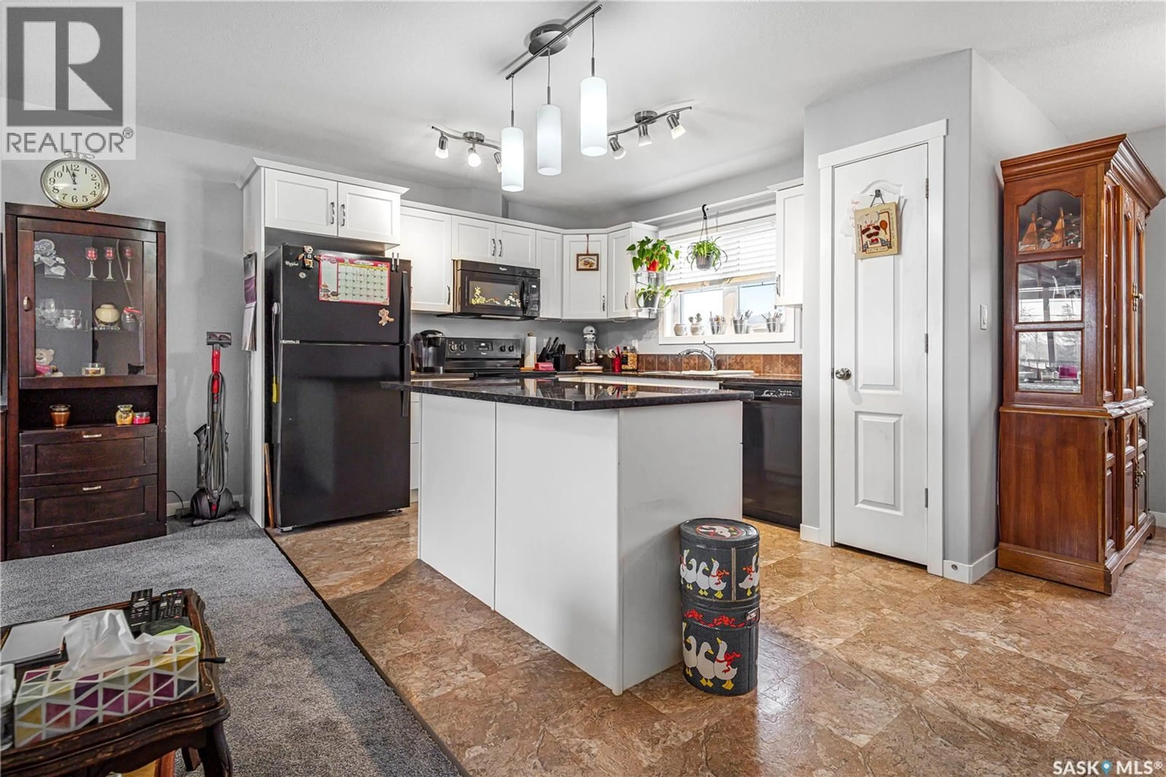 Open concept kitchen, ceramic/tile floor for 303 - 3440 AVONHURST DRIVE, Regina Saskatchewan S4R2E1