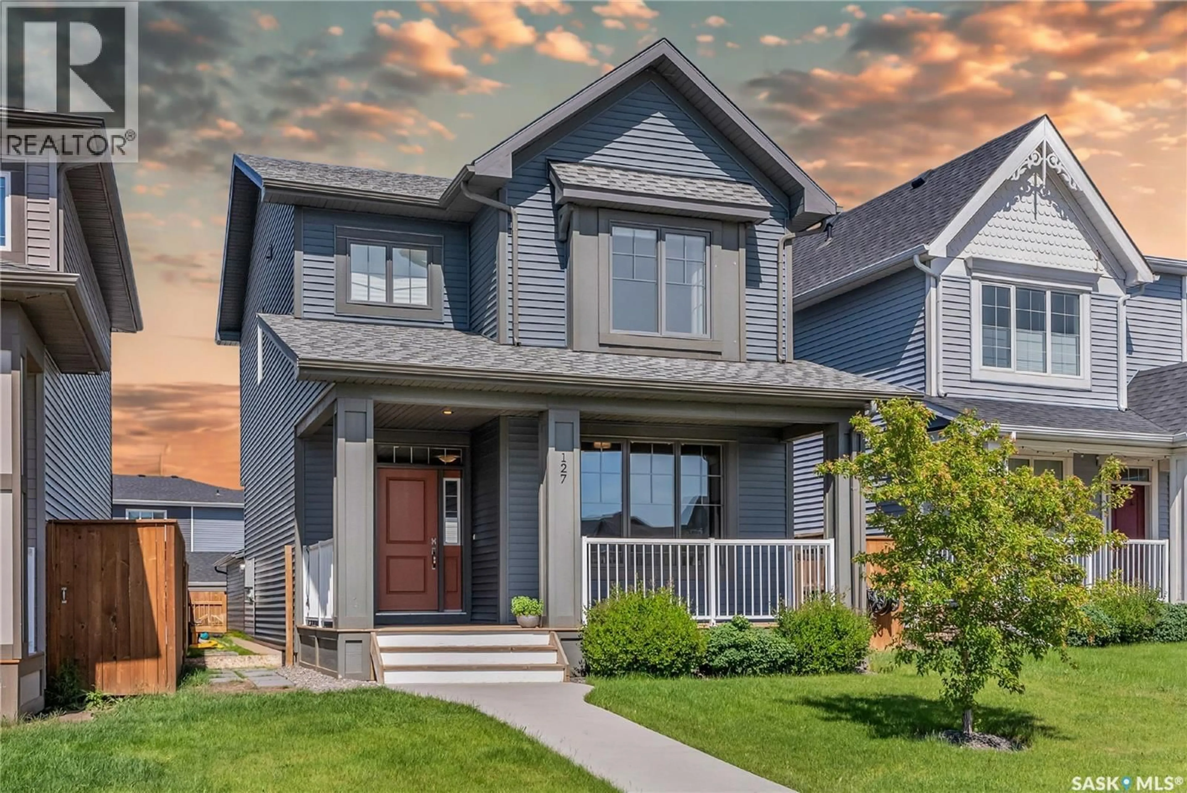 Home with vinyl exterior material, street for 127 NEWTON WAY, Saskatoon Saskatchewan S7V0N6