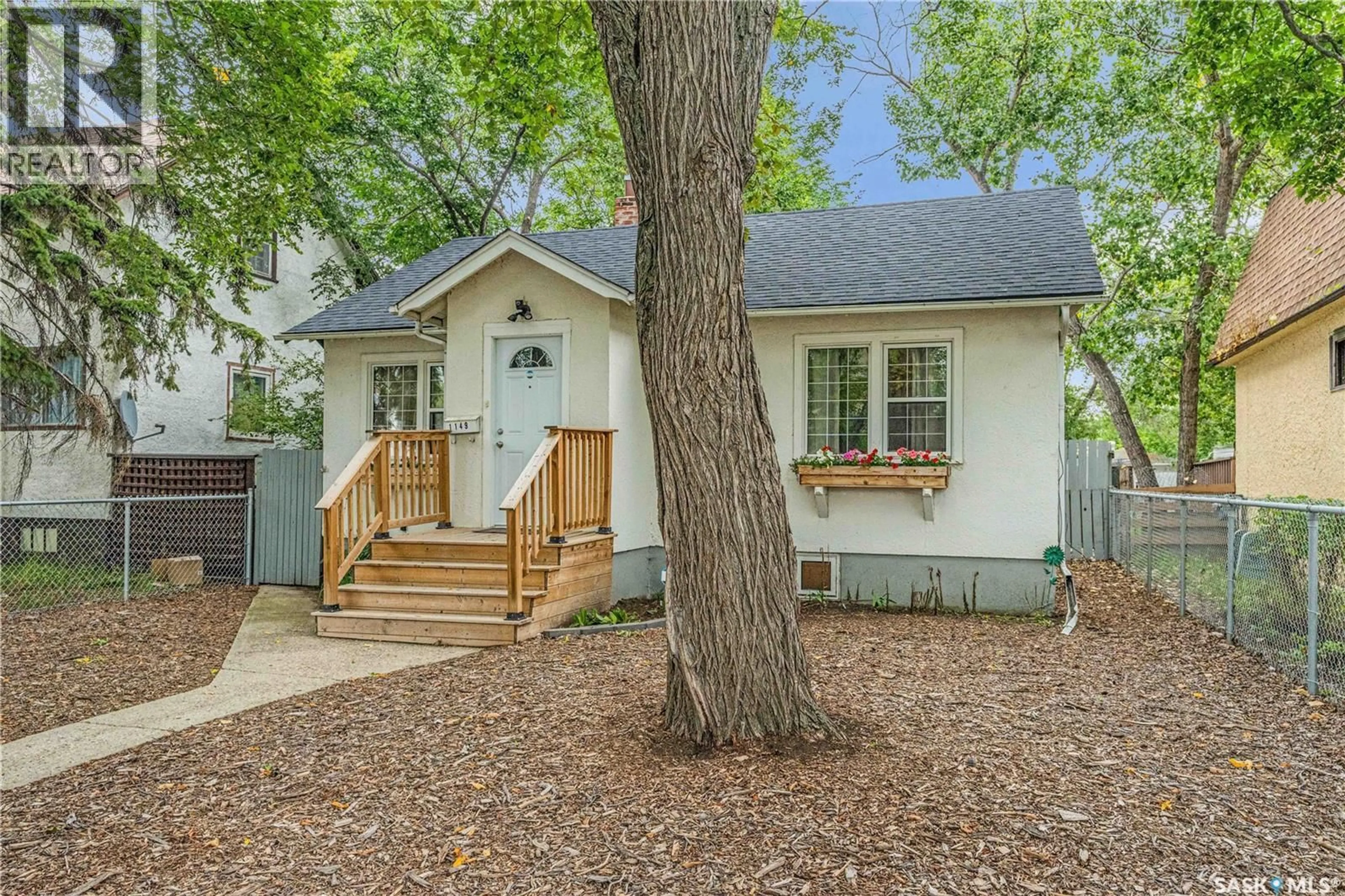 Home with vinyl exterior material, street for 1149 ELPHINSTONE STREET, Regina Saskatchewan S4T3M2