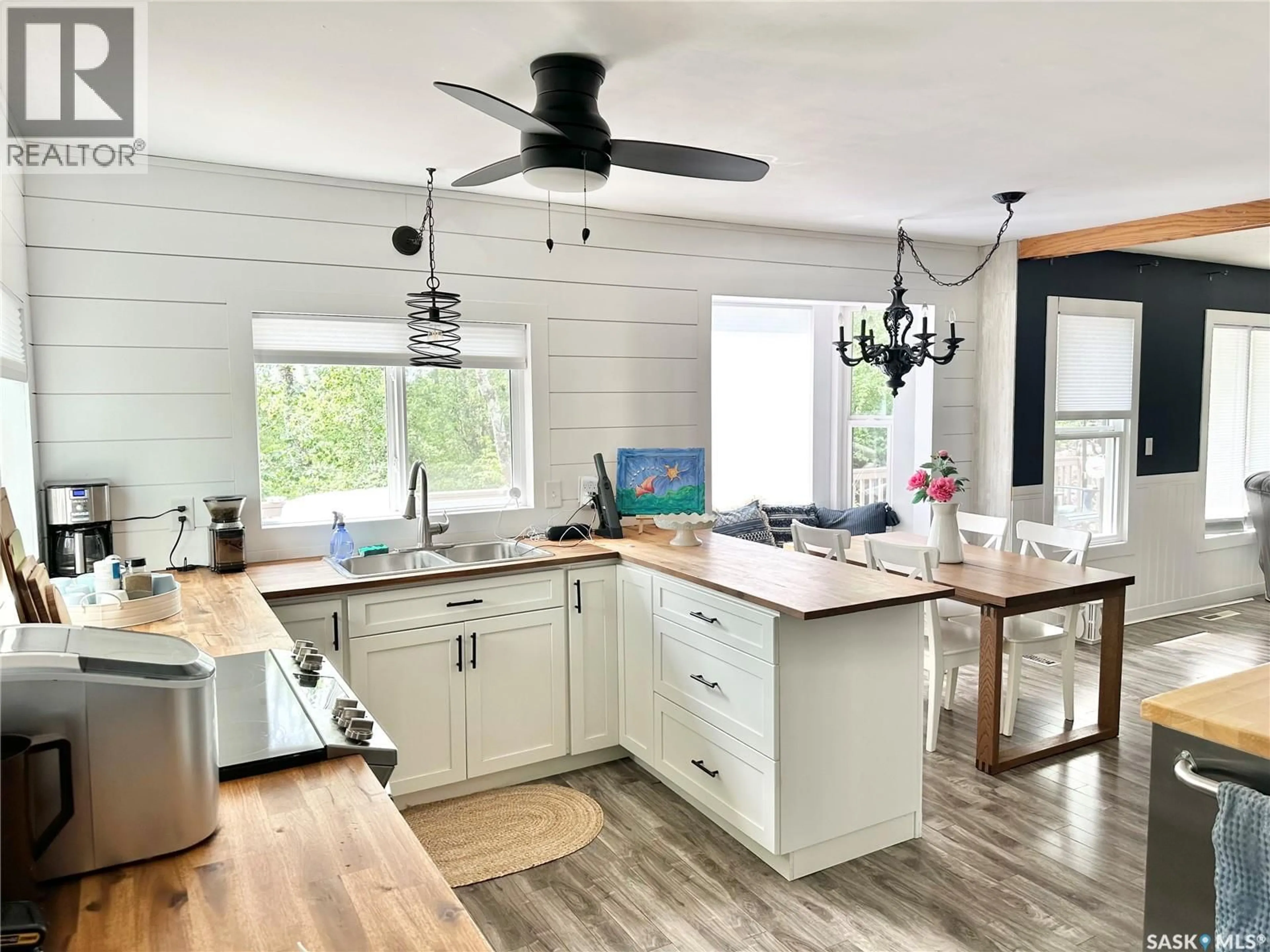 Open concept kitchen, wood/laminate floor for 100 MISTY BAY DRIVE, Big Shell Saskatchewan S0J2G0