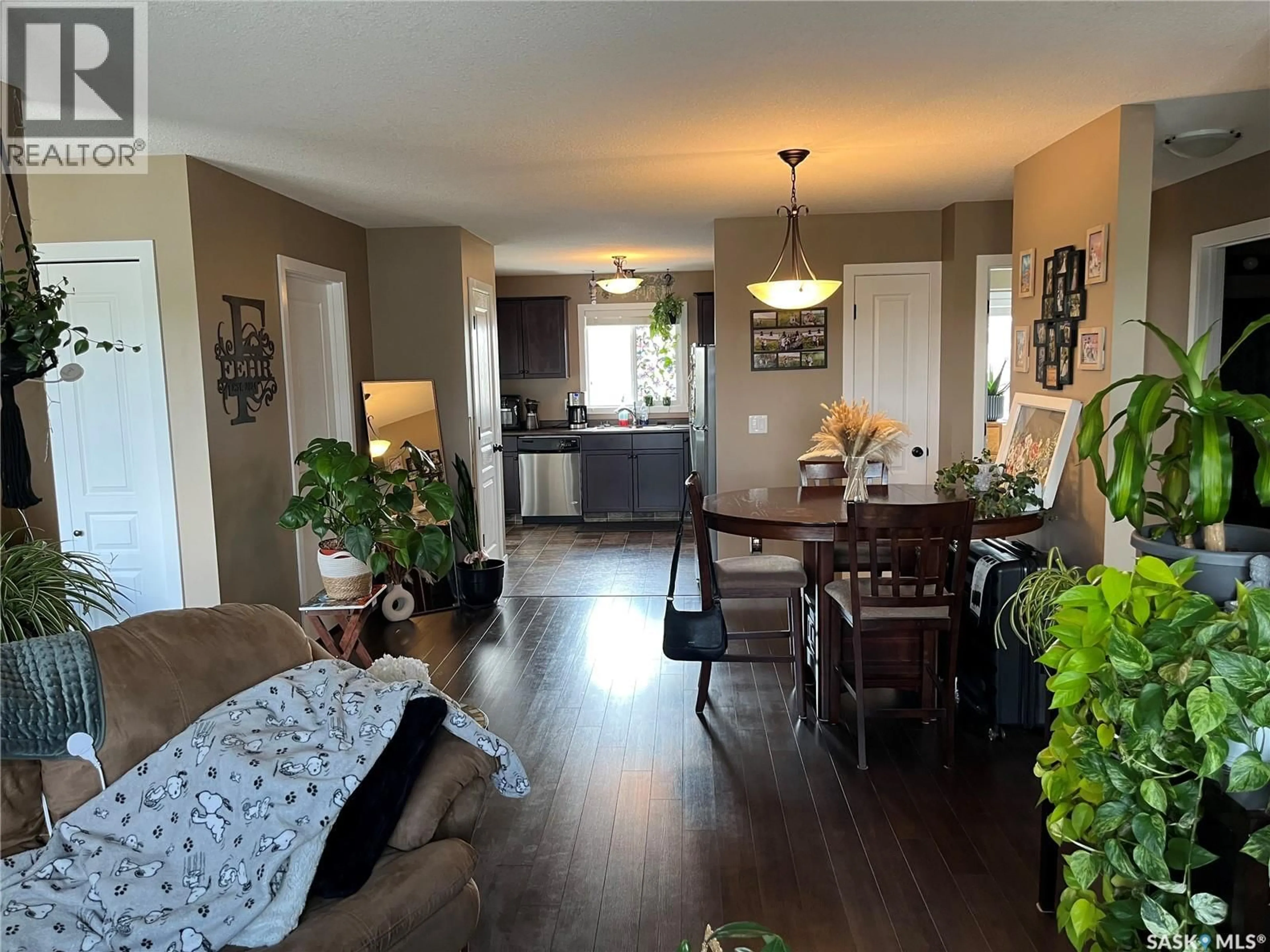 Open concept kitchen, wood/laminate floor for 4850 HARBOUR LANDING DRIVE, Regina Saskatchewan S4W0K9