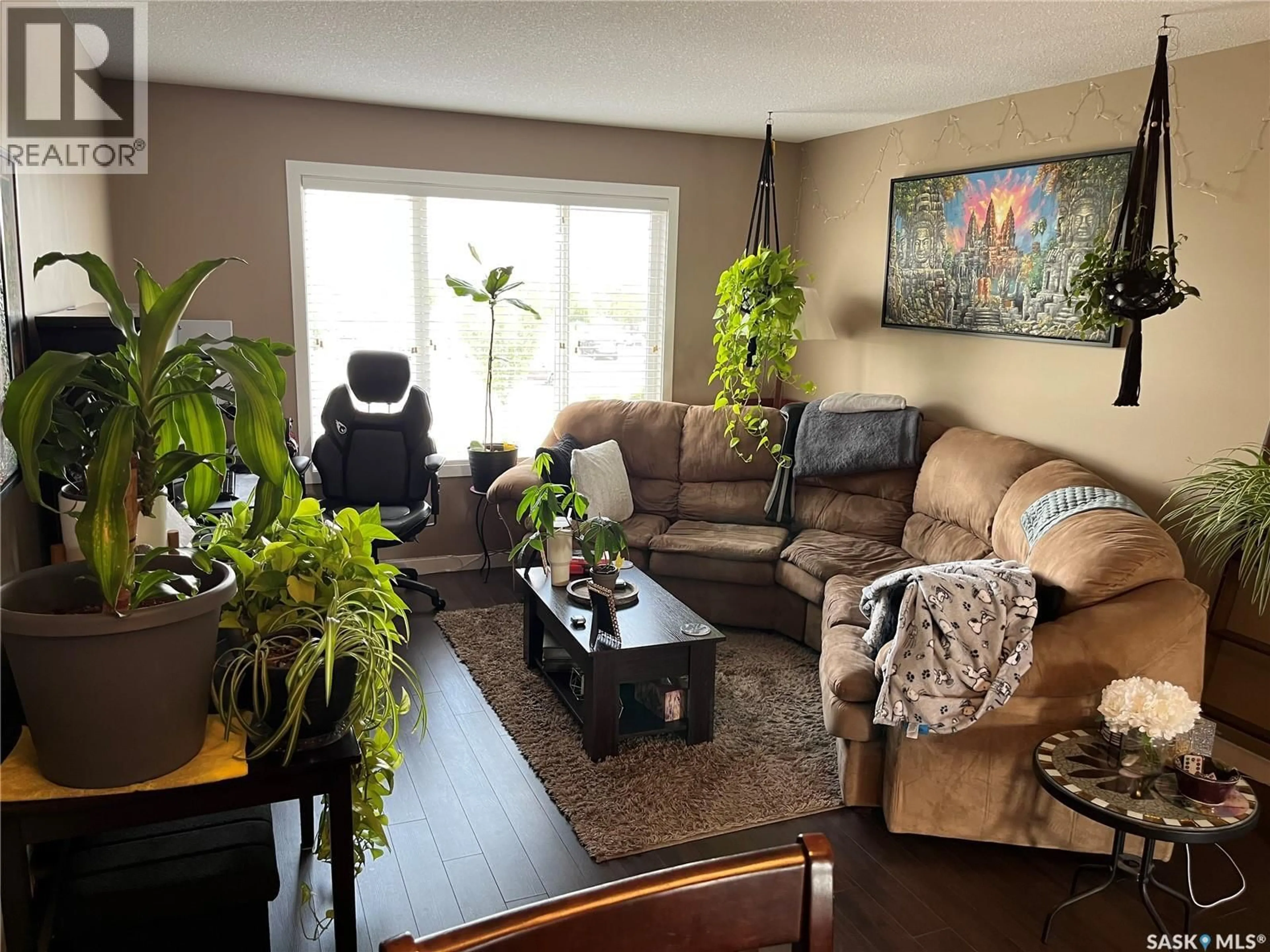 Living room with furniture, wood/laminate floor for 4850 HARBOUR LANDING DRIVE, Regina Saskatchewan S4W0K9