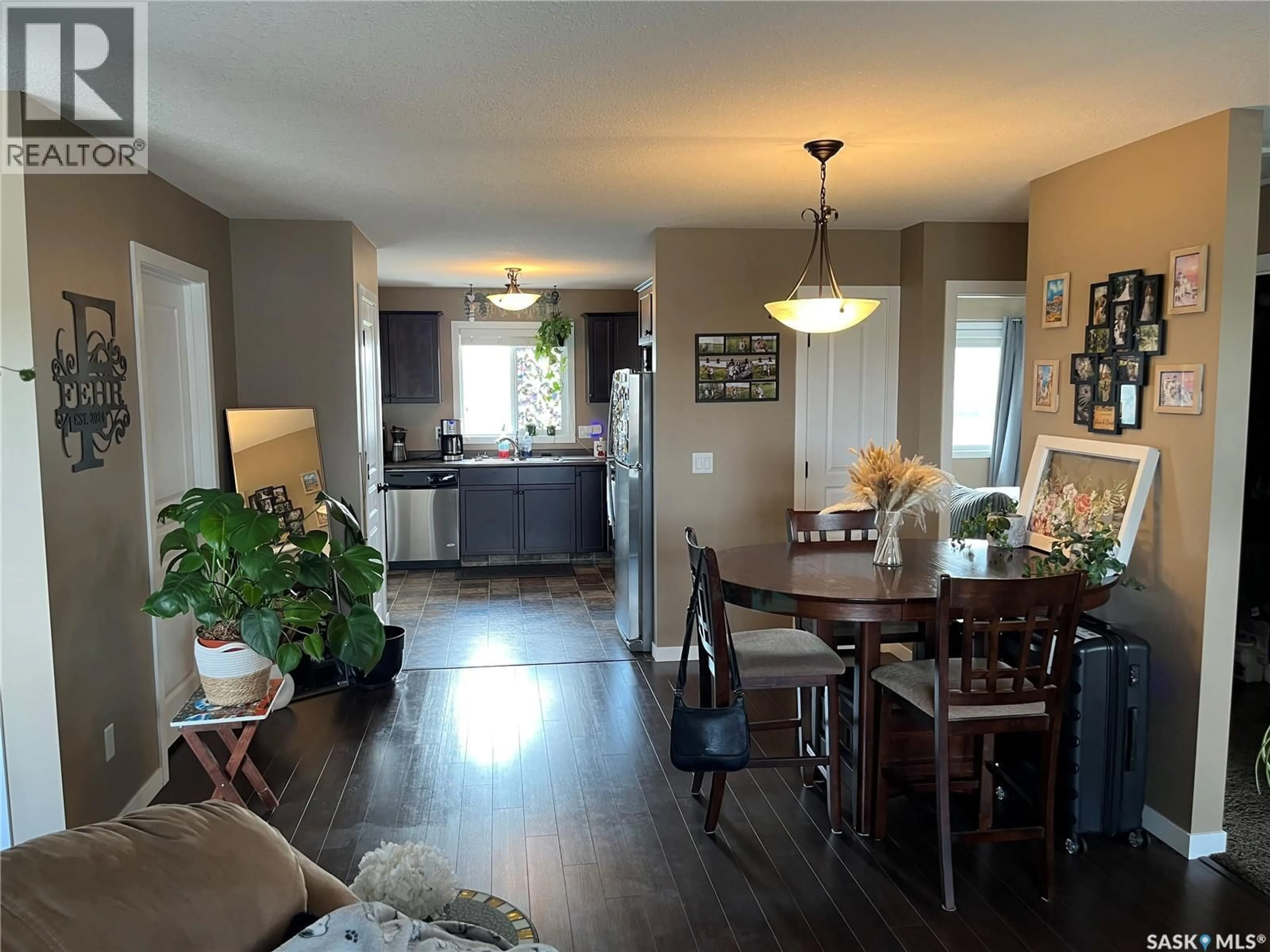 Open concept kitchen, wood/laminate floor for 4850 HARBOUR LANDING DRIVE, Regina Saskatchewan S4W0K9