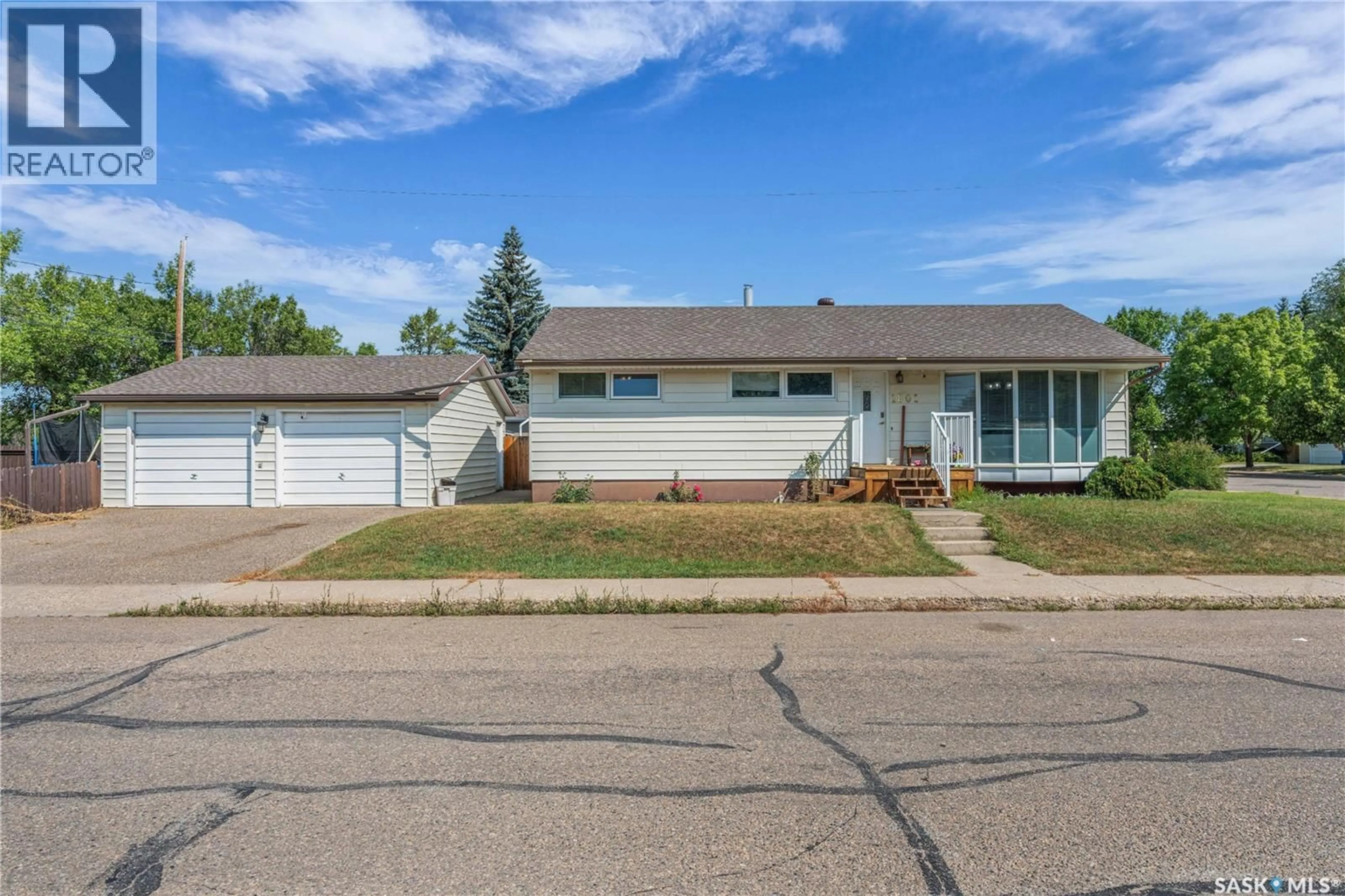 Home with vinyl exterior material, street for 1801 96TH STREET, North Battleford Saskatchewan S9A0J1