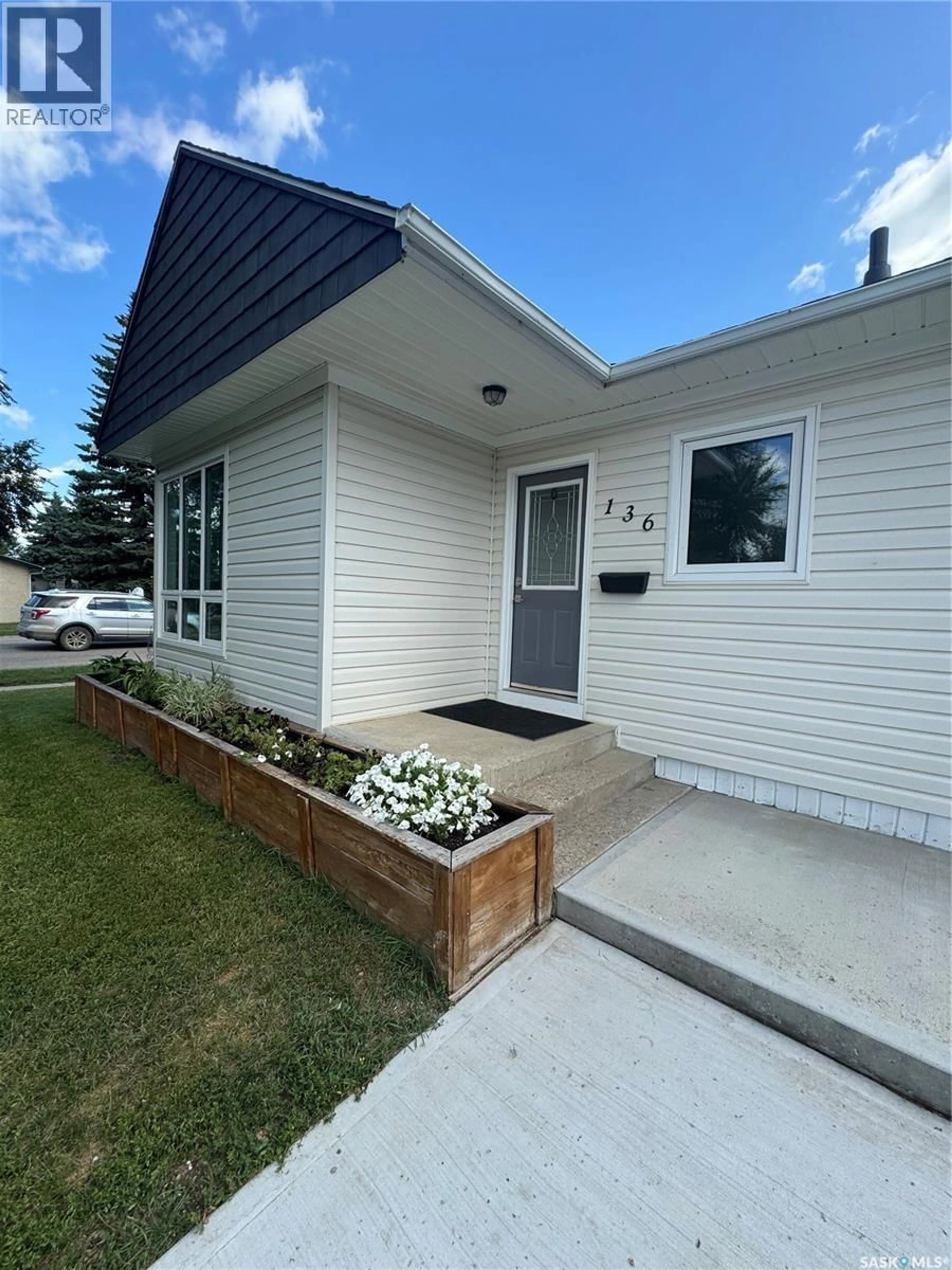 Home with vinyl exterior material, street for 136 10TH STREET, Weyburn Saskatchewan S4H1G9