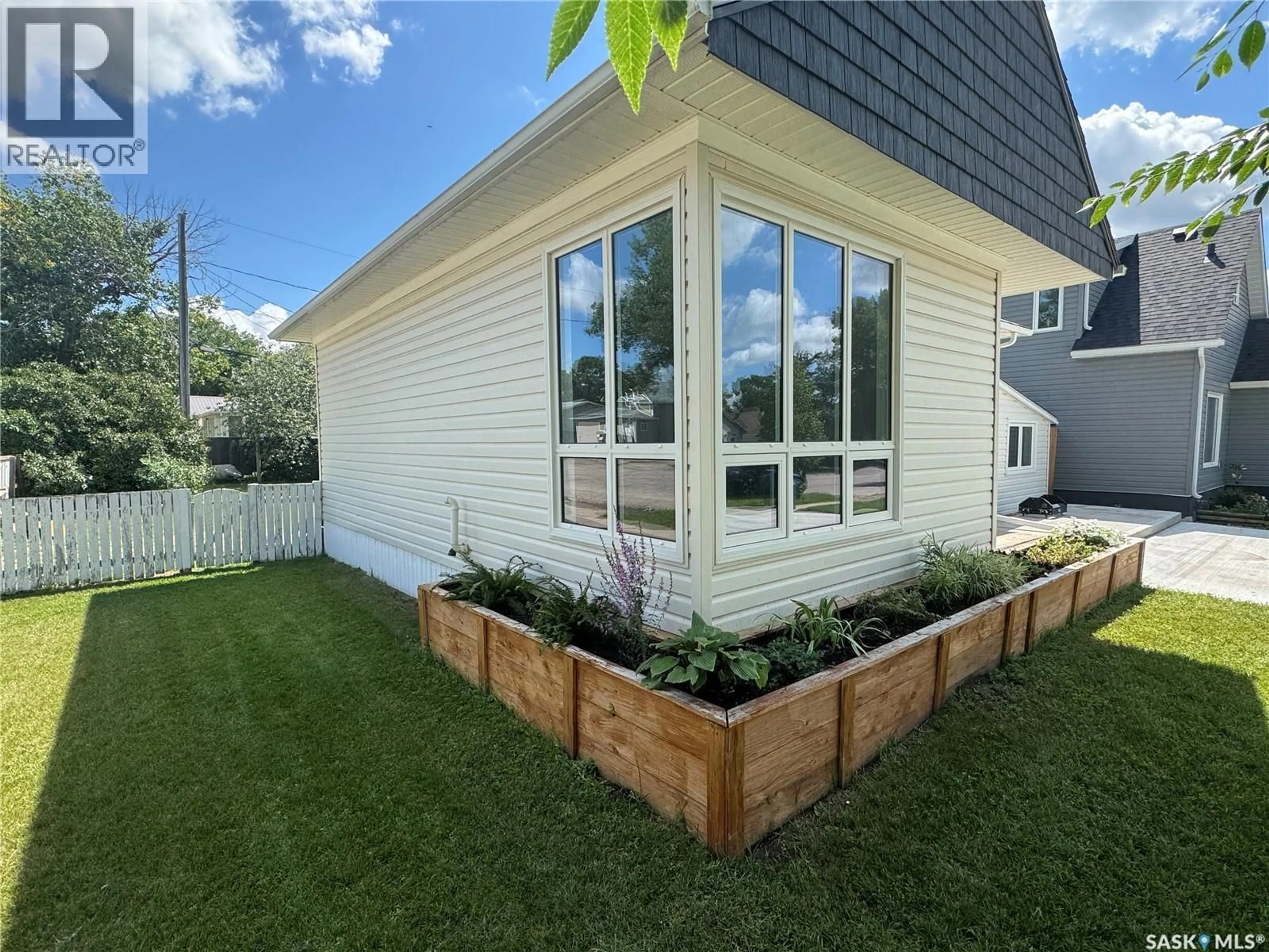 Home with vinyl exterior material, street for 136 10TH STREET, Weyburn Saskatchewan S4H1G9