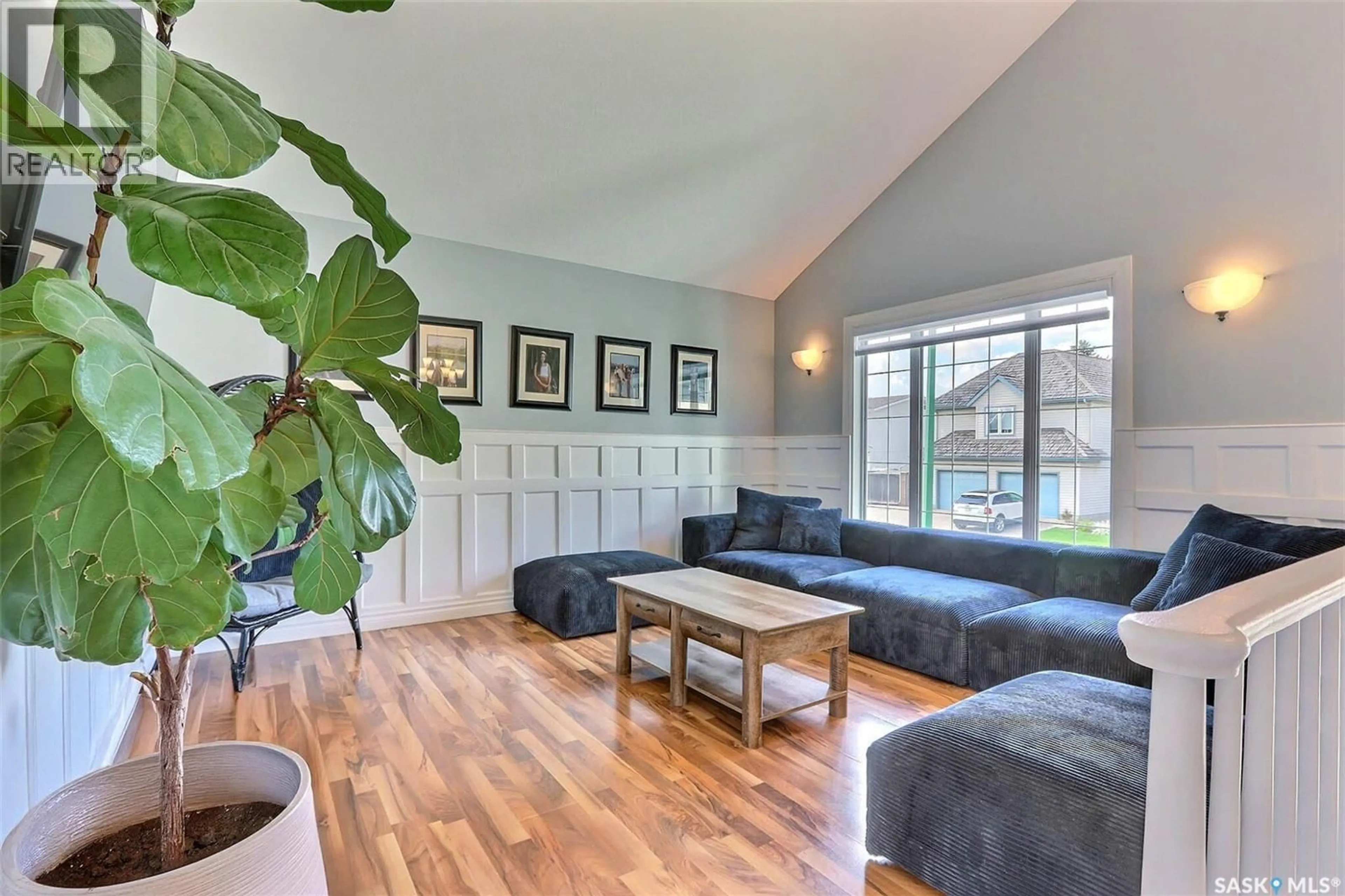 Living room with furniture, wood/laminate floor for 441 MAHON DRIVE, Prince Albert Saskatchewan S6V7Z8