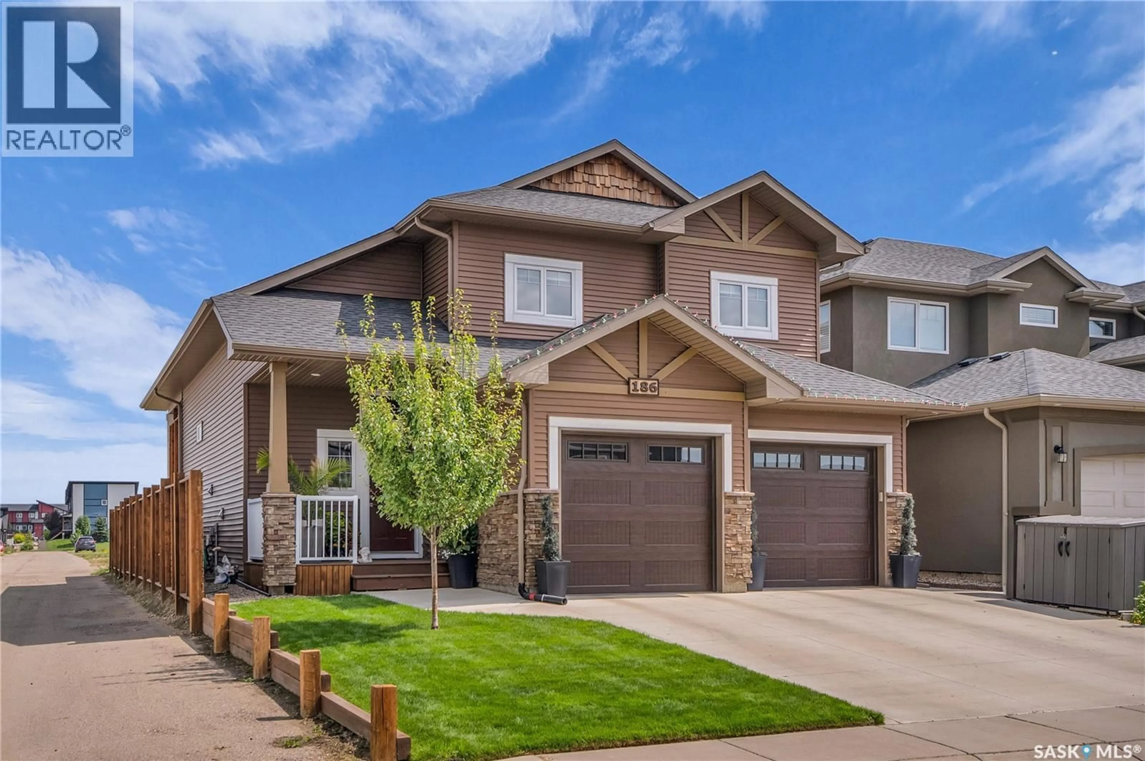 Home with vinyl exterior material, street for 186 BOYKOWICH BEND, Saskatoon Saskatchewan S7W0R4