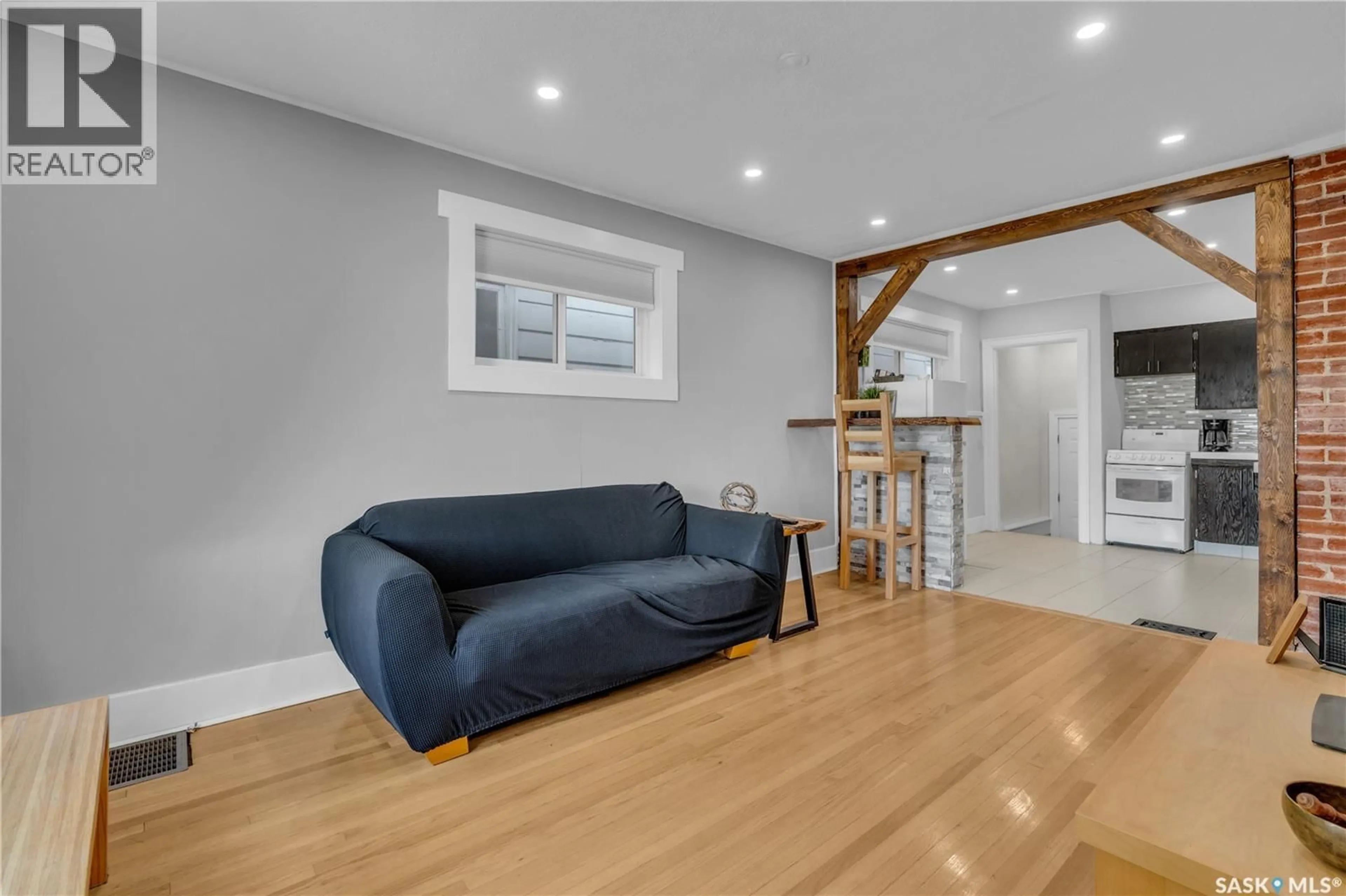 Living room with furniture, wood/laminate floor for 2212 EDGAR STREET, Regina Saskatchewan S4N3K9