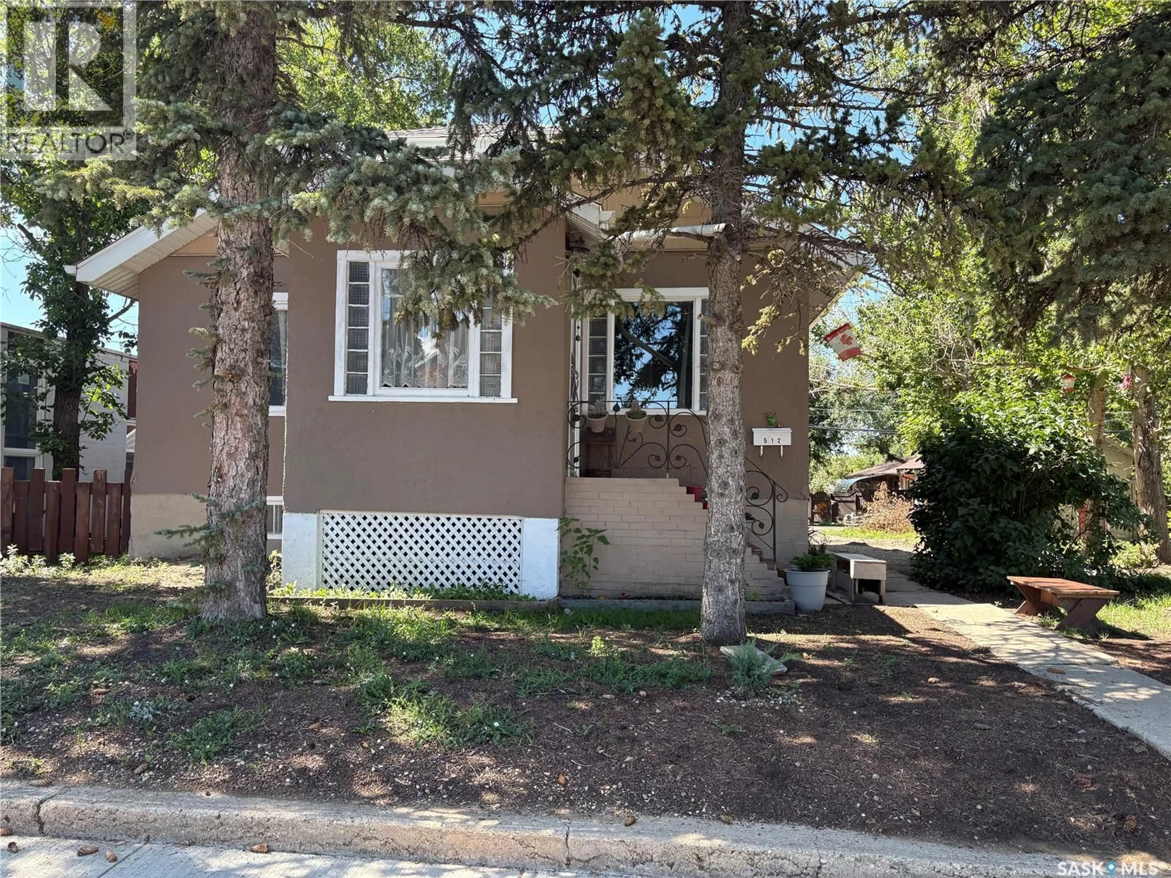 Home with vinyl exterior material, street for 512 CENTRE STREET, Assiniboia Saskatchewan S0H0B0