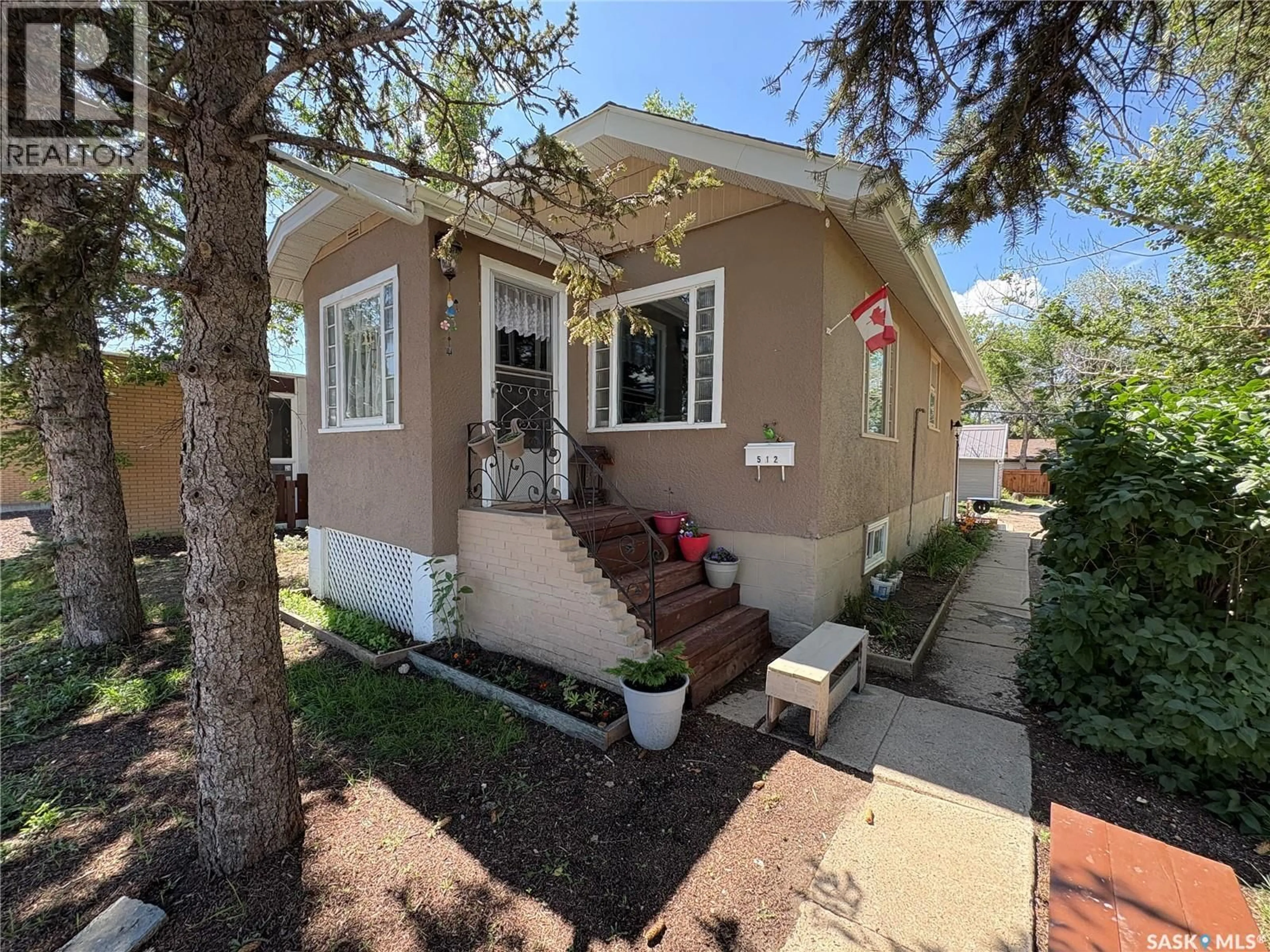 Home with vinyl exterior material, street for 512 CENTRE STREET, Assiniboia Saskatchewan S0H0B0