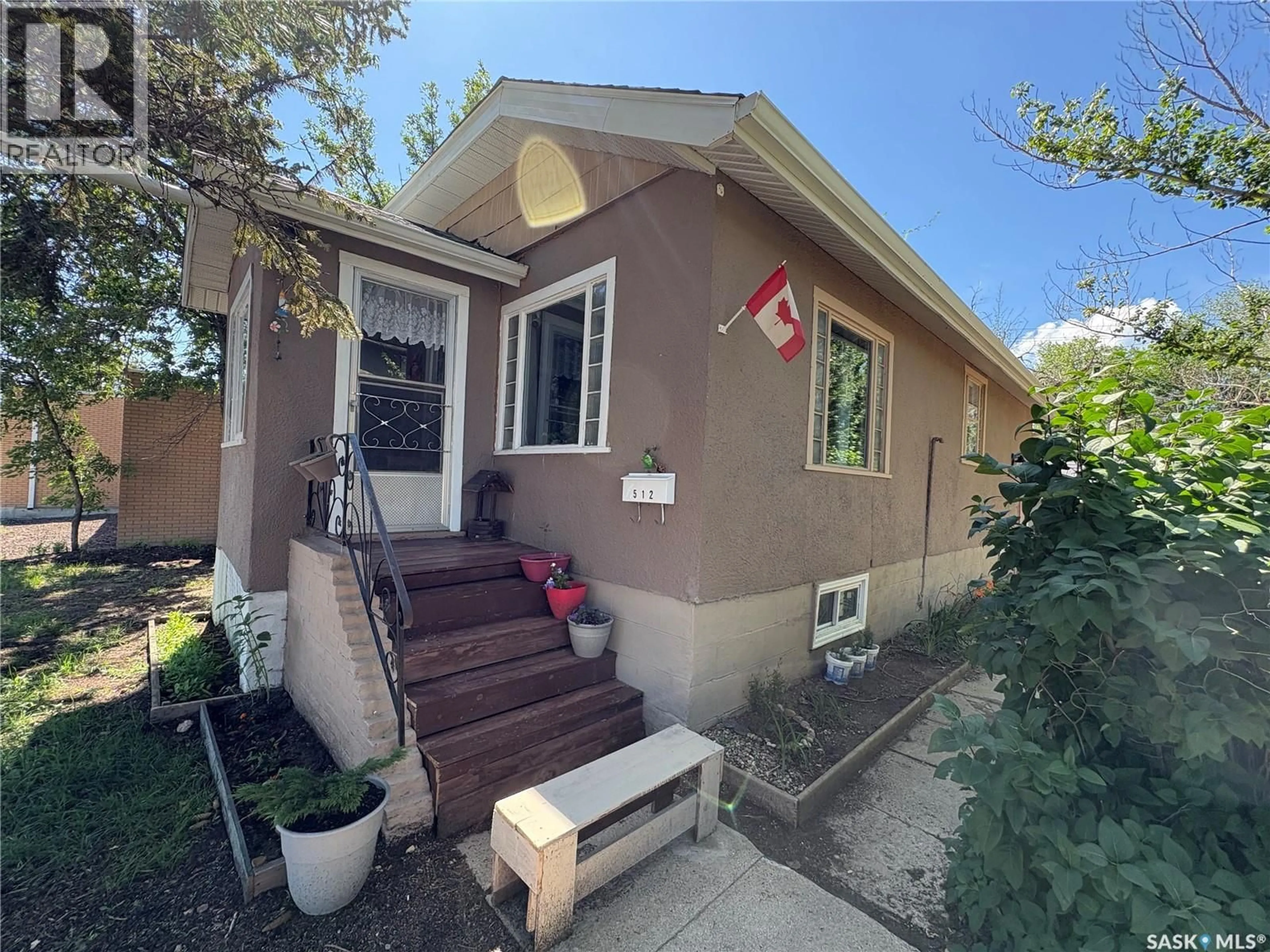 Home with vinyl exterior material, street for 512 CENTRE STREET, Assiniboia Saskatchewan S0H0B0