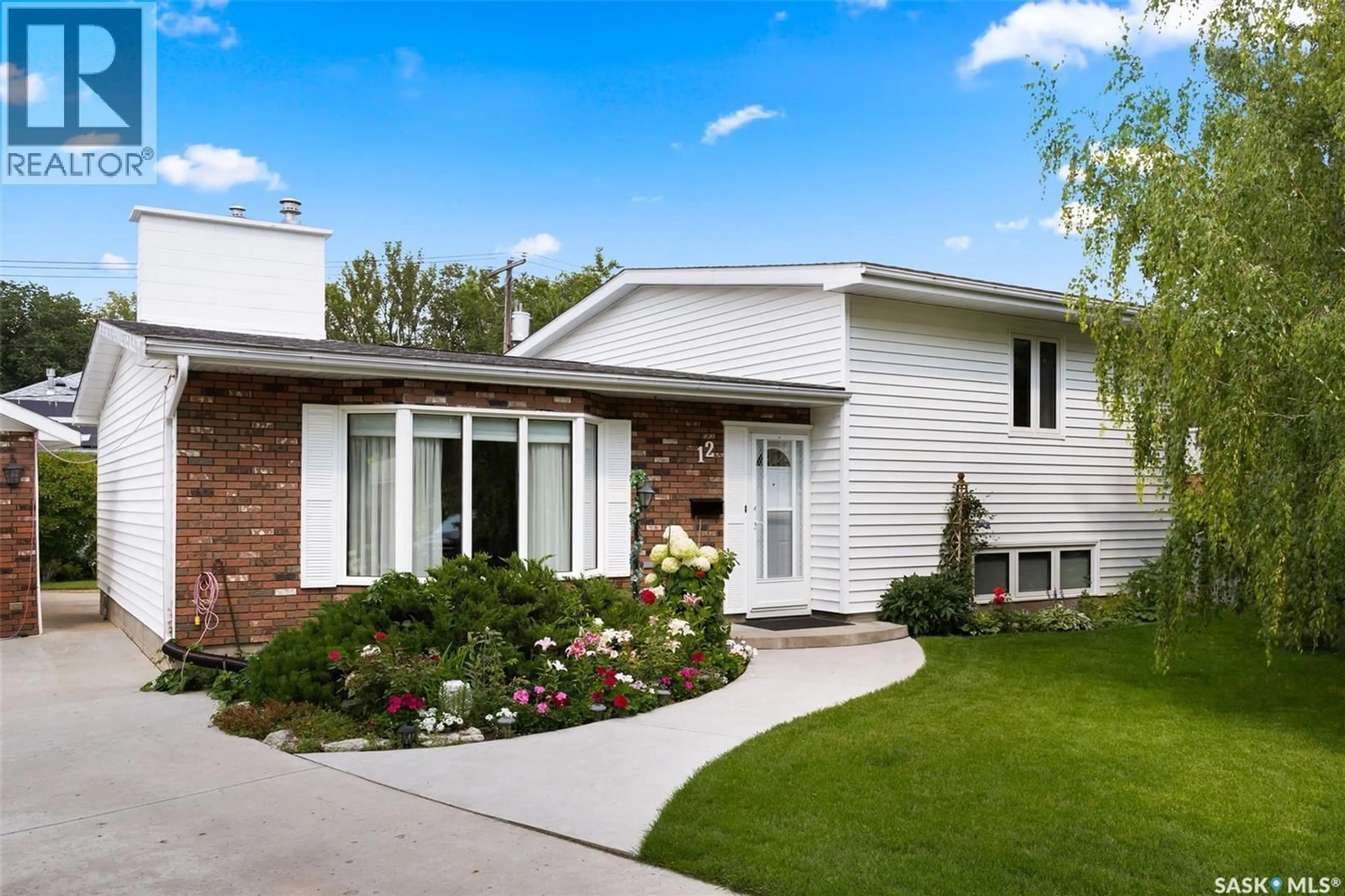 Home with vinyl exterior material, street for 12 CASTLE BAY, Regina Saskatchewan S4S4X4