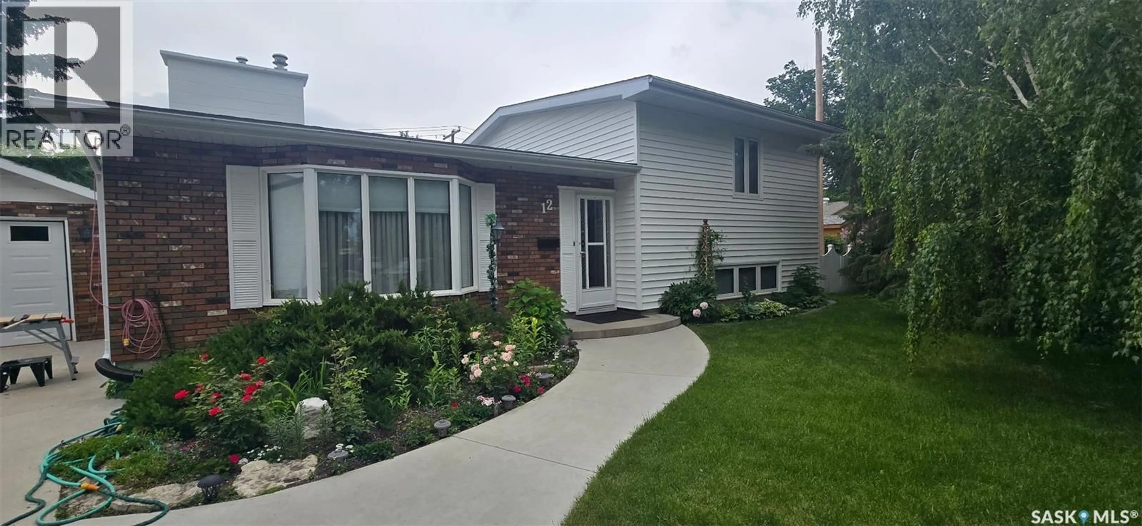 Home with vinyl exterior material, street for 12 CASTLE BAY, Regina Saskatchewan S4S4X4