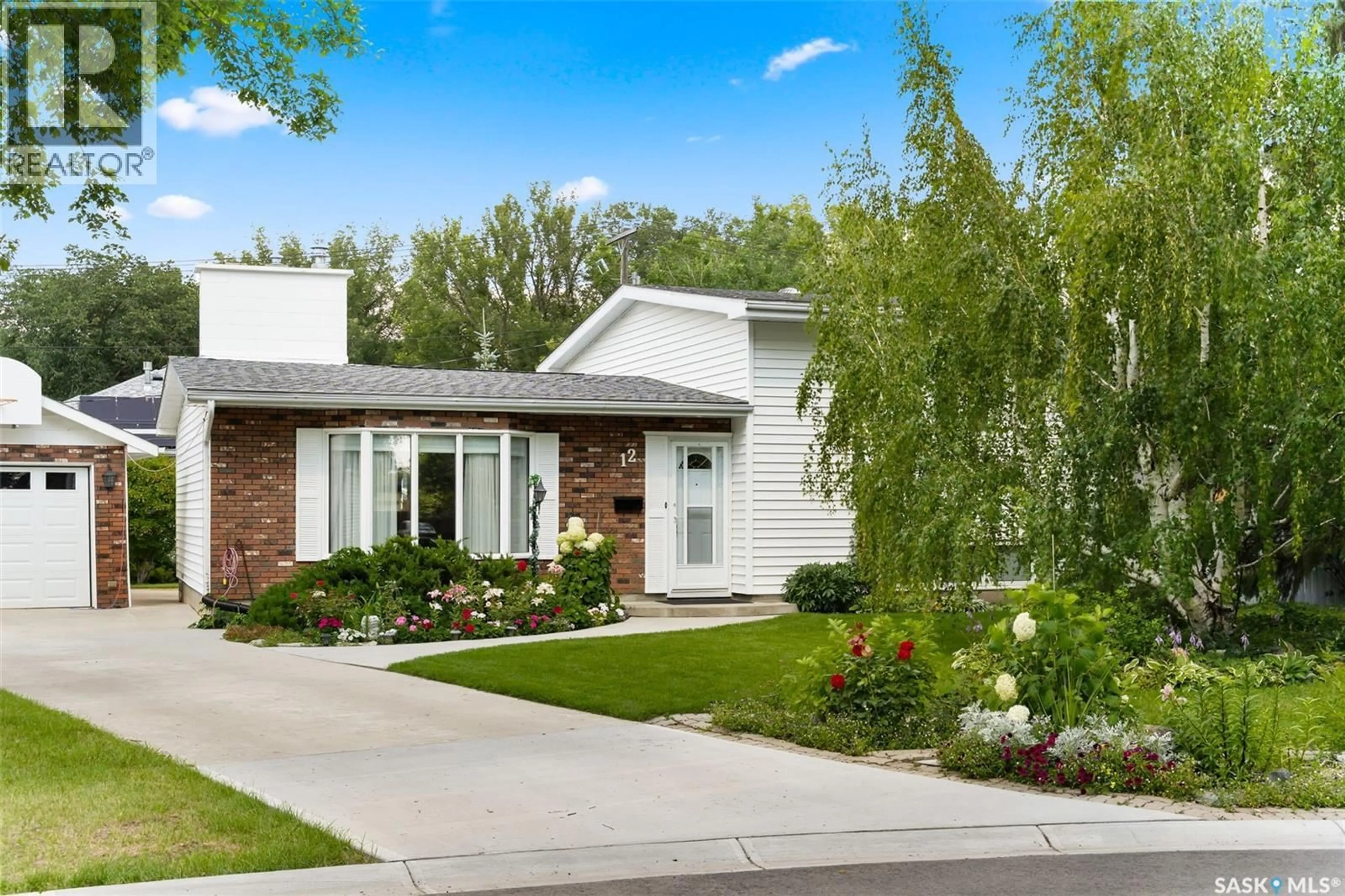 Home with brick exterior material, street for 12 CASTLE BAY, Regina Saskatchewan S4S4X4