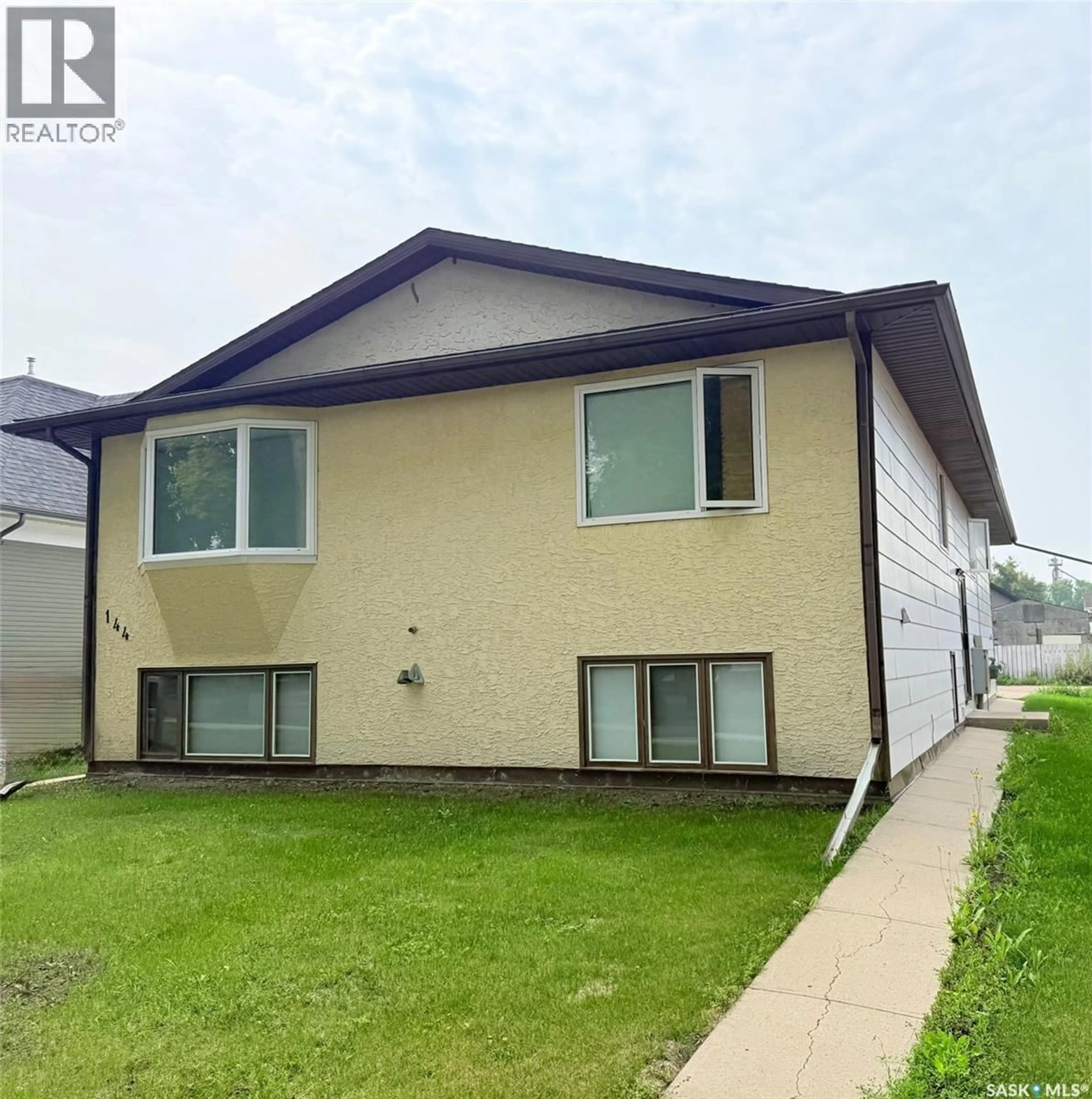 Home with vinyl exterior material, street for 144 FIRST AVENUE, Yorkton Saskatchewan S3N1J8