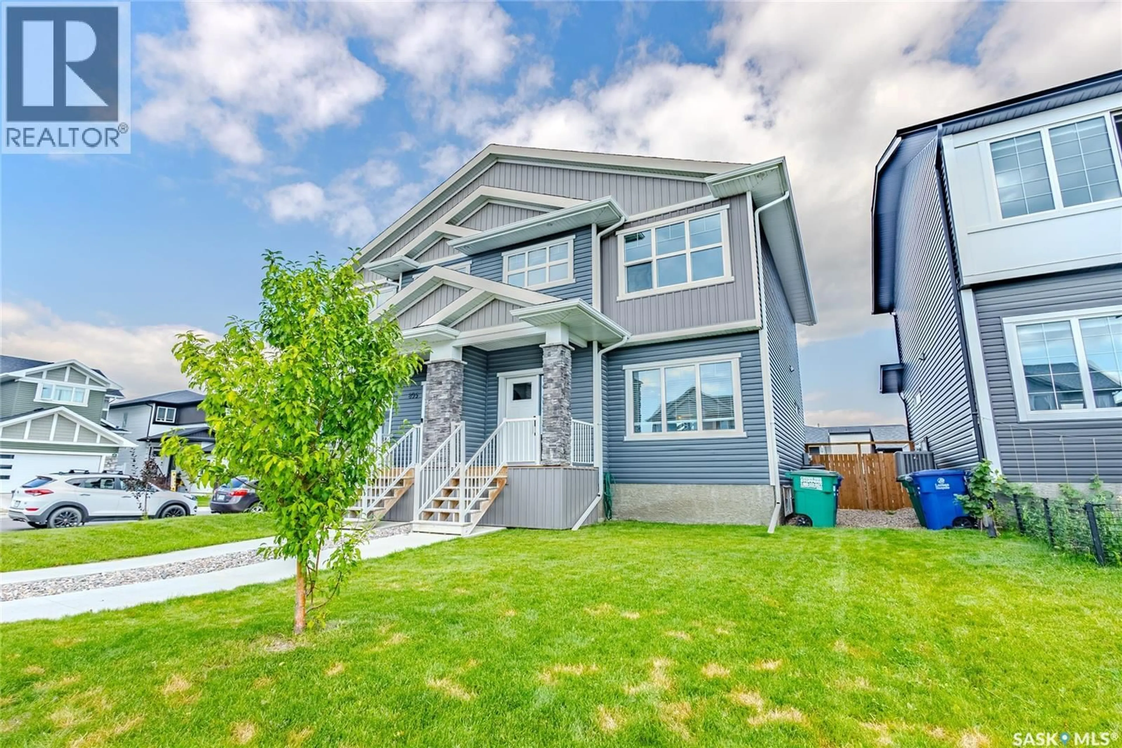 Home with vinyl exterior material, street for 891 MCFAULL RISE, Saskatoon Saskatchewan S7V0S9
