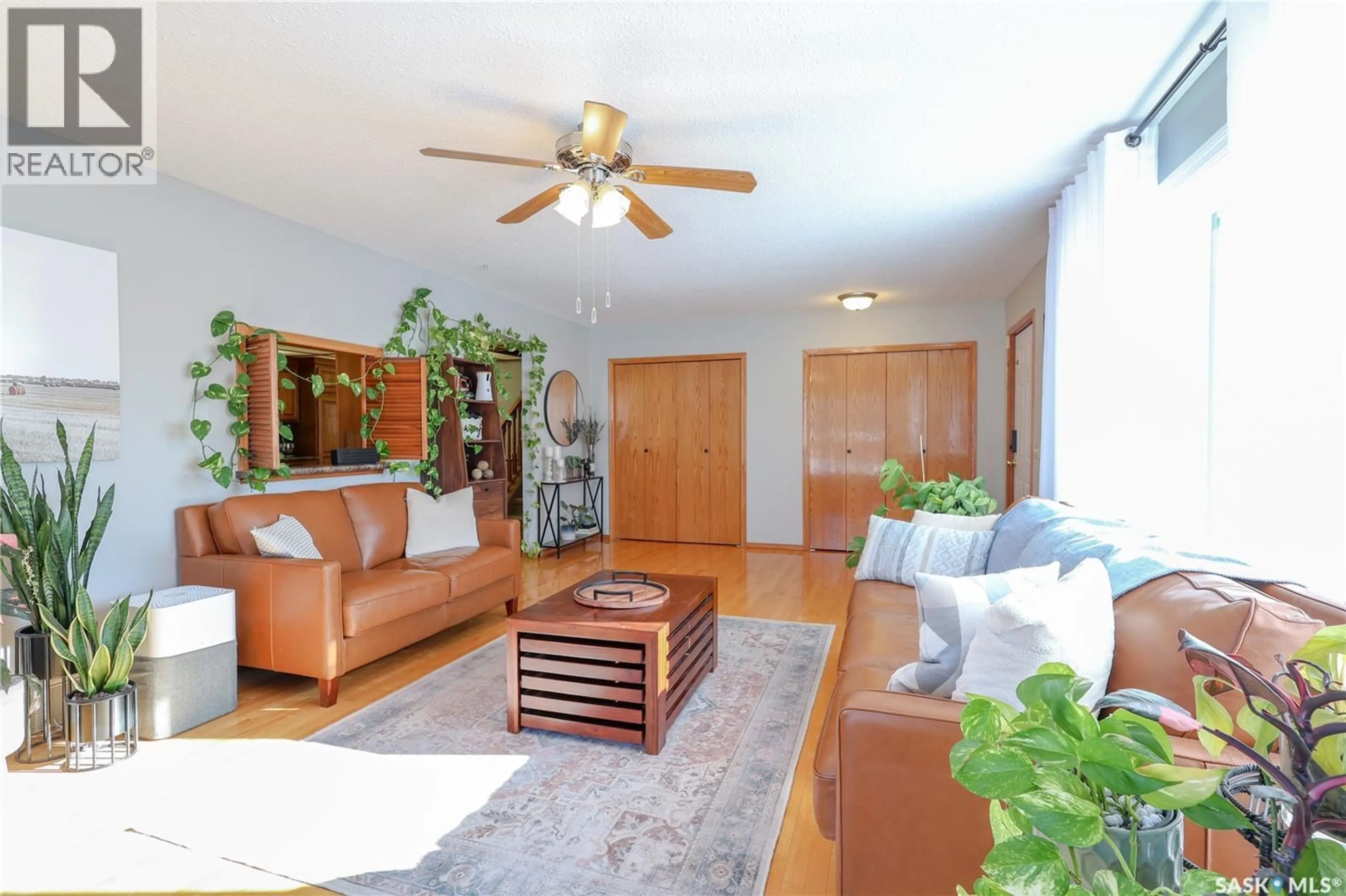 Living room with furniture, wood/laminate floor for MACDONALD ROAD, Prince Albert Rm No. 461 Saskatchewan S6V5R1
