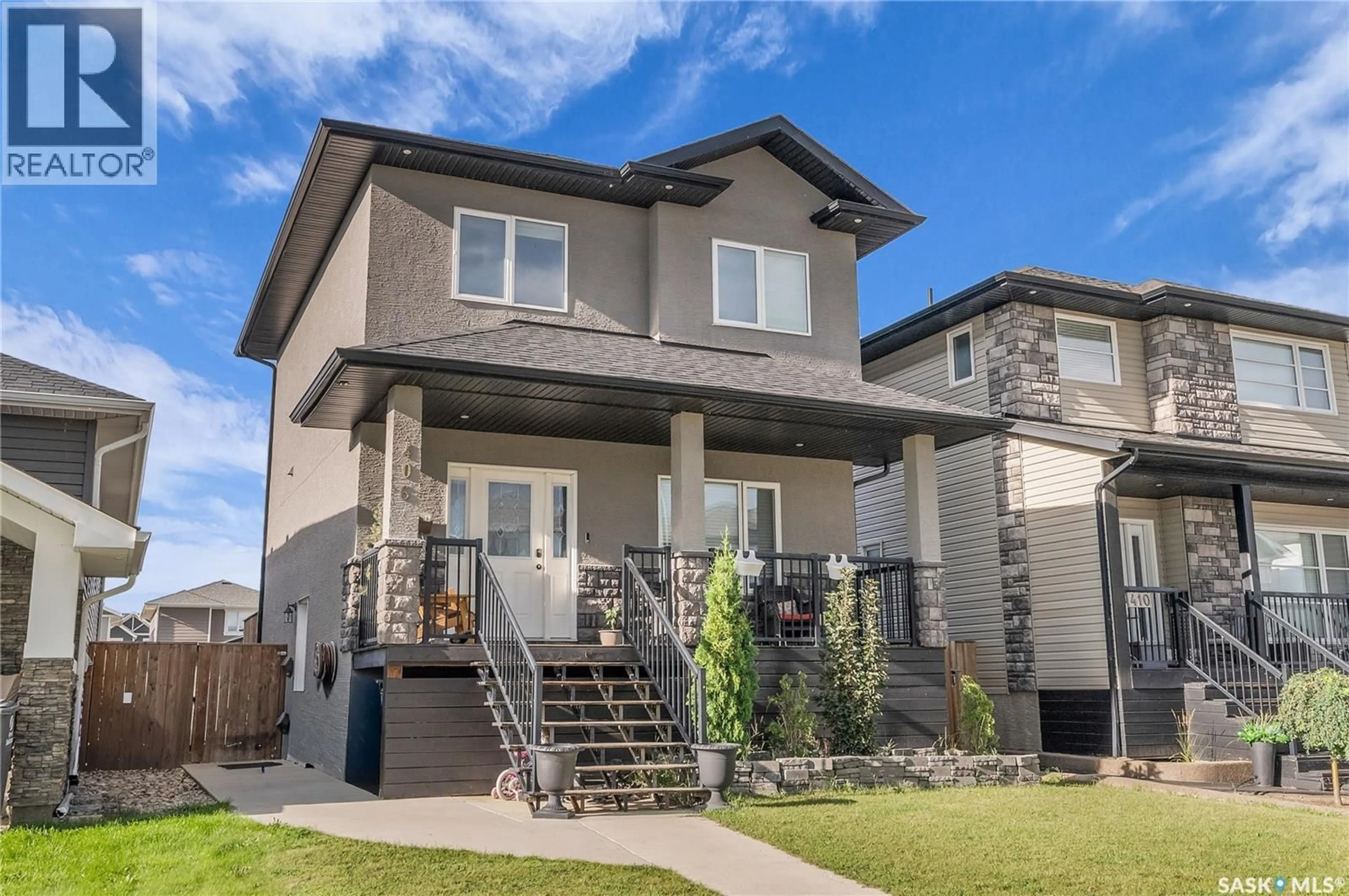 Home with brick exterior material, street for 406 KLOPPENBURG STREET, Saskatoon Saskatchewan S7W0N7
