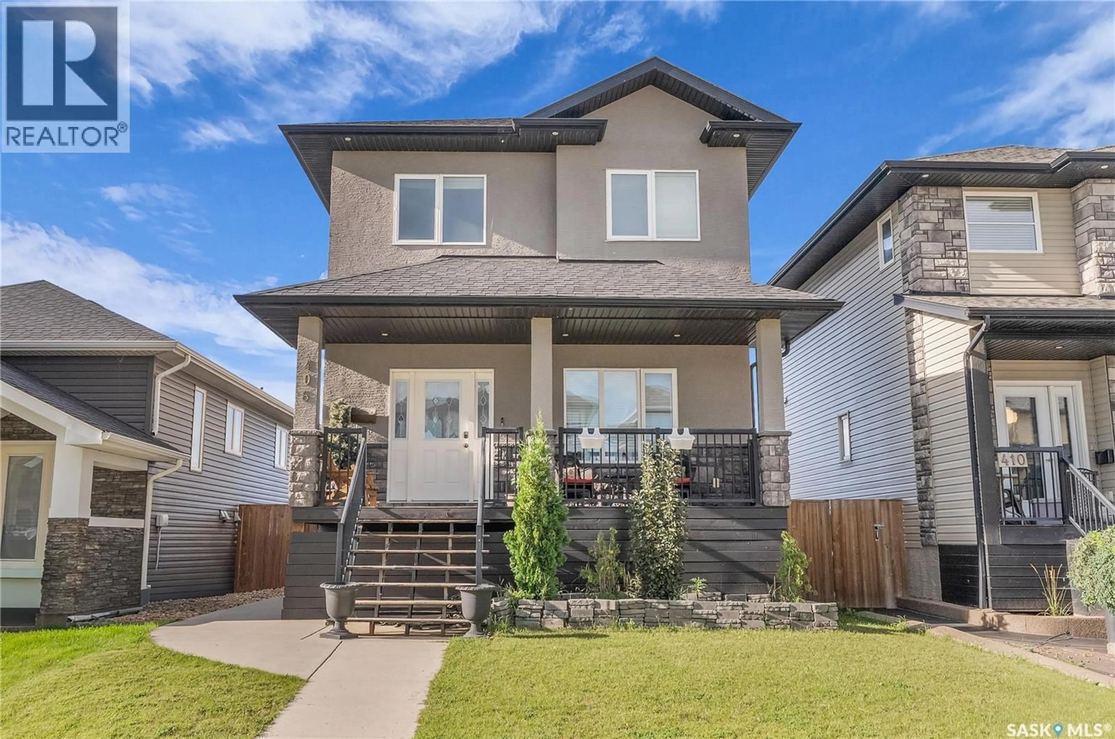 Home with vinyl exterior material, street for 406 KLOPPENBURG STREET, Saskatoon Saskatchewan S7W0N7