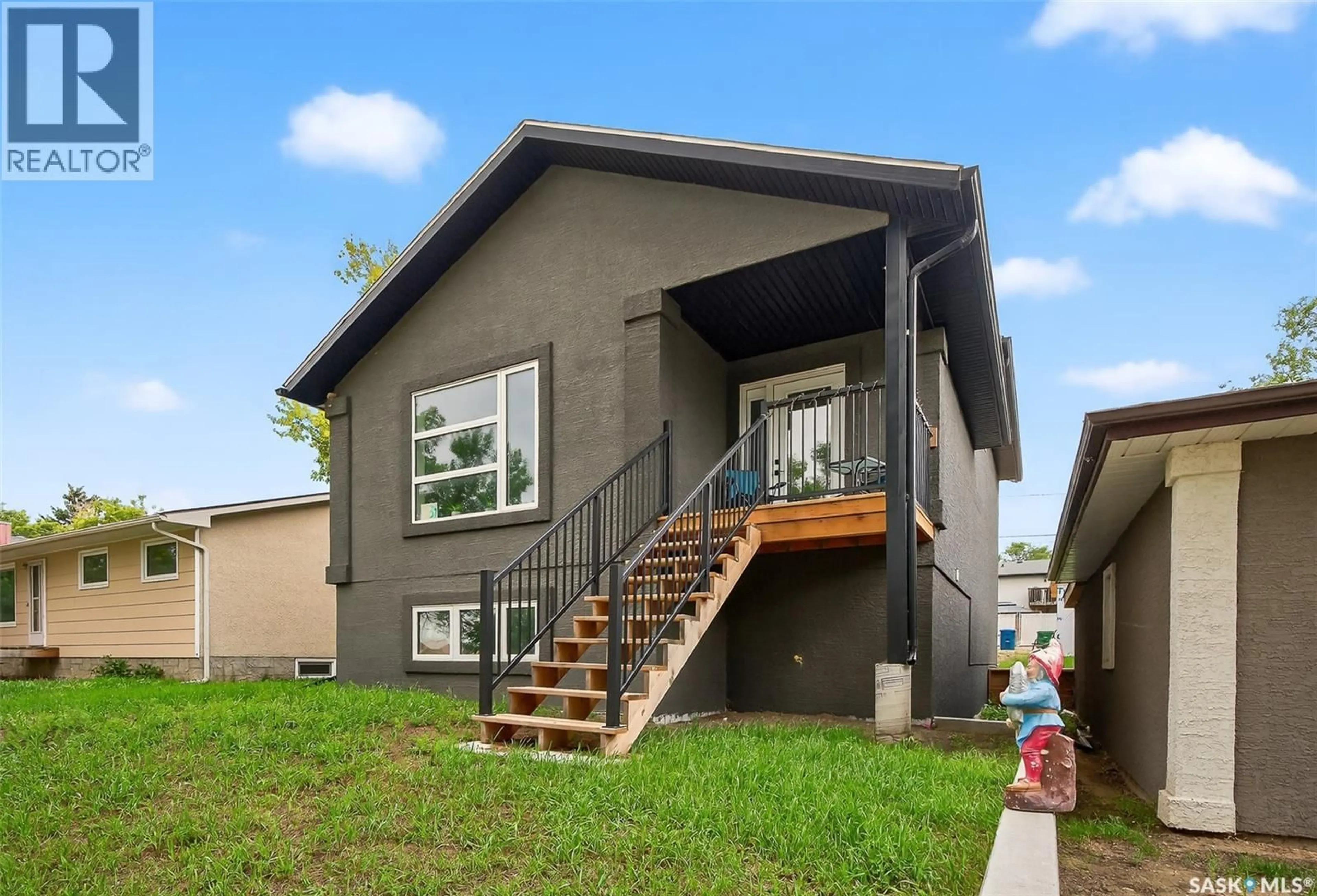 Home with vinyl exterior material, street for 1034 STADACONA STREET, Moose Jaw Saskatchewan S6H2B2
