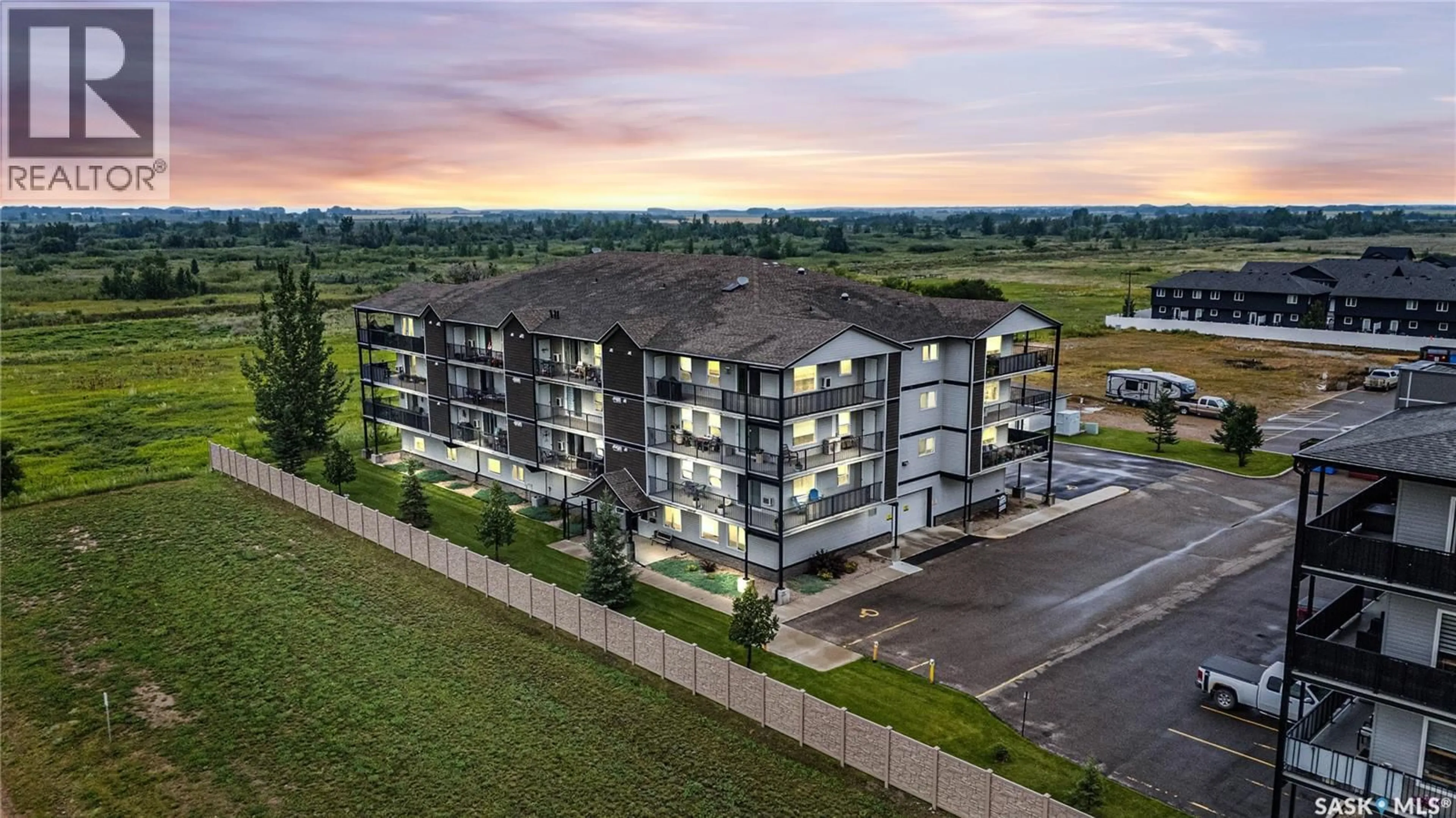 A pic from outside/outdoor area/front of a property/back of a property/a pic from drone, building for 135 - 303 BEAUDRY CRESCENT, Martensville Saskatchewan S0K2T1