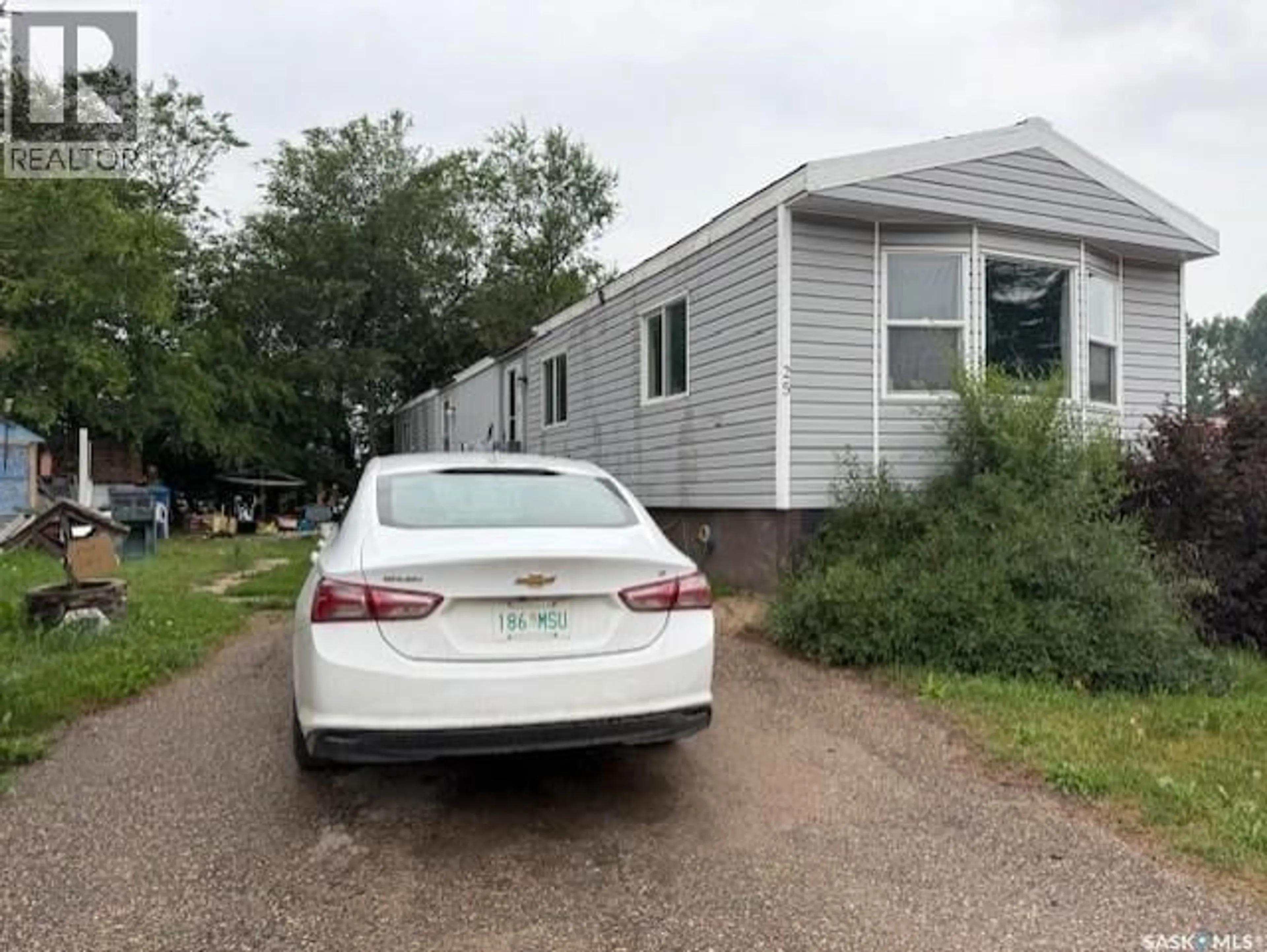 Home with vinyl exterior material, street for 25 555 DIELSCHNEIDER ROAD, Melville Saskatchewan S0A2P0