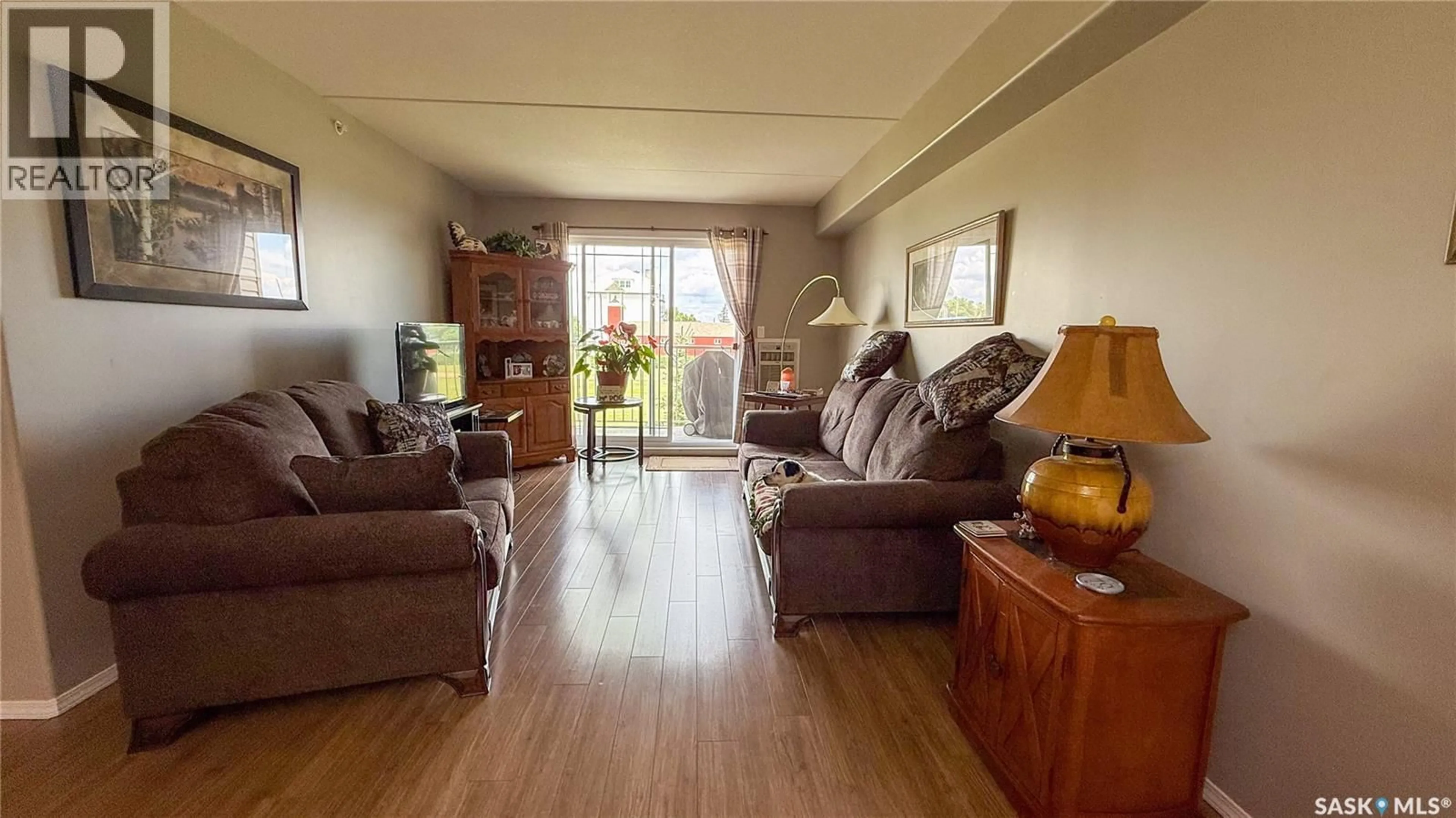 Living room with furniture, wood/laminate floor for 206 2 18TH STREET, Battleford Saskatchewan S0M0E0